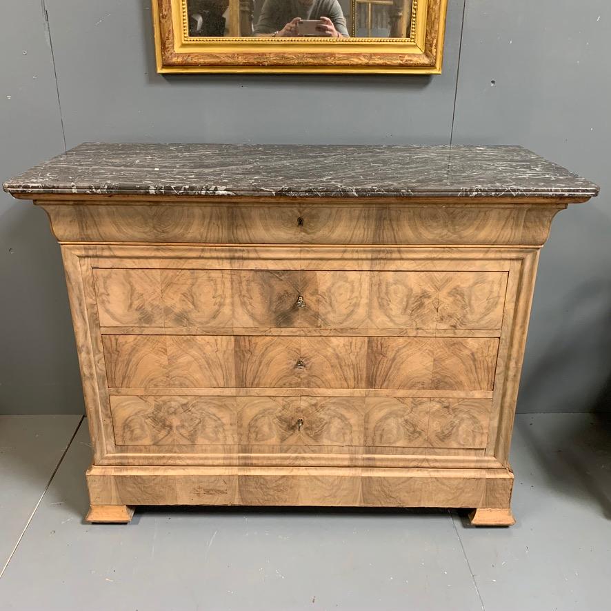 Very decorative French 19th century bleached burr walnut Louis Philippe commode with its original charcoal and white marble top and a totals of 5 drawers.
Fabulous burr walnut grain which is book matched to the front and runs throughout the drawers