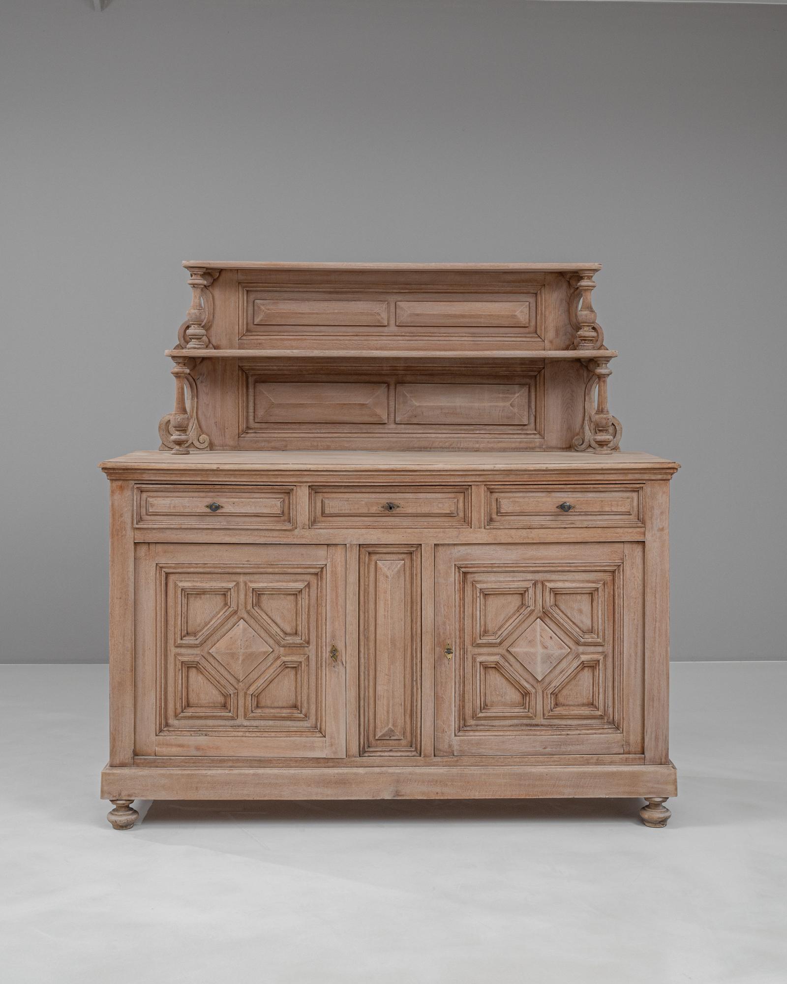 Introduce a touch of timeless elegance to your home with this exquisite 19th Century French Bleached Oak Cupboard. Crafted from high-quality oak, this stunning piece boasts a beautifully bleached finish that highlights the natural grain and texture