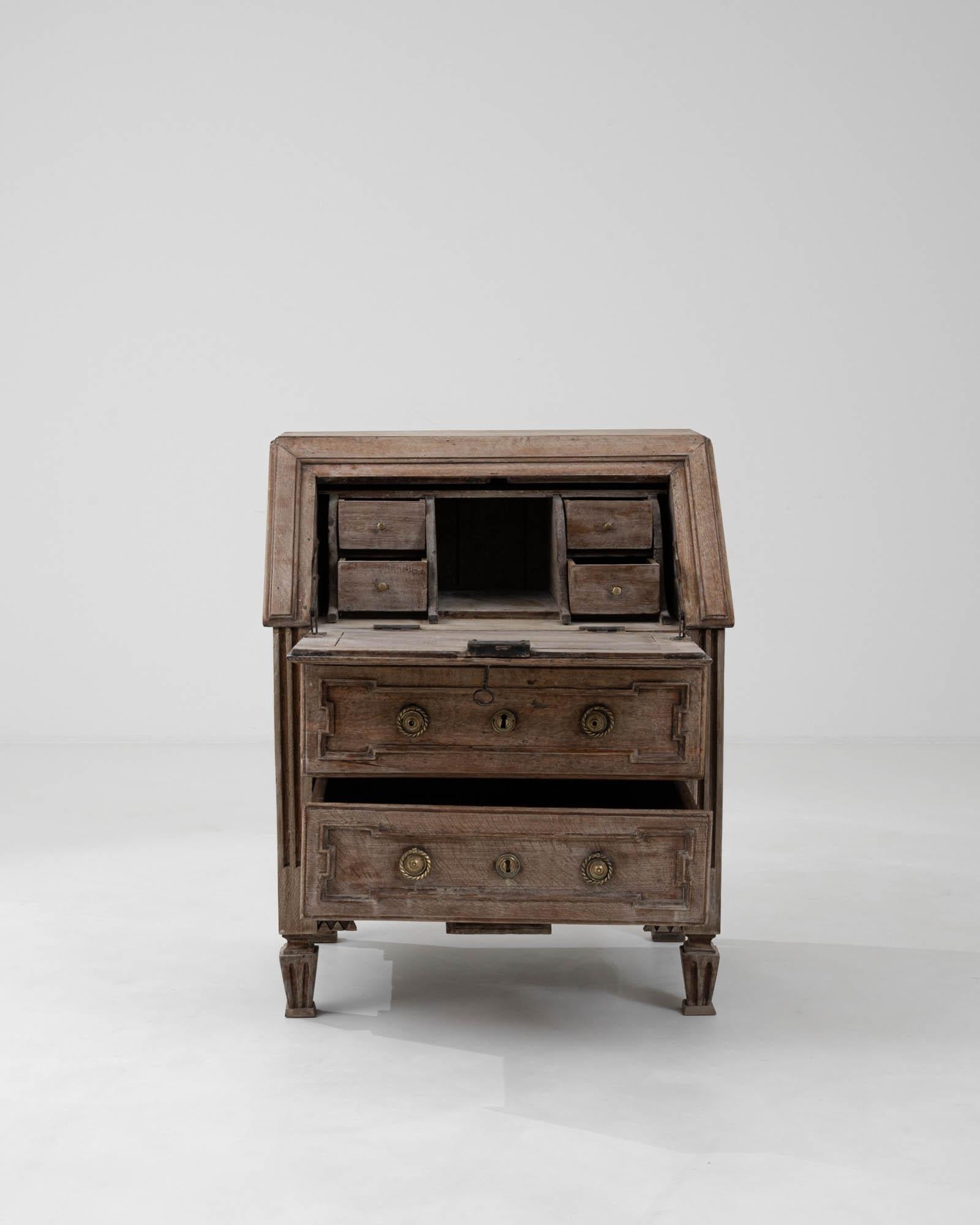 Step back in time with this exquisite 19th Century French Bleached Oak Desk, a piece that embodies the grace of antique craftsmanship. Constructed from the finest bleached oak, its patina whispers stories of a bygone era. This desk is more than just