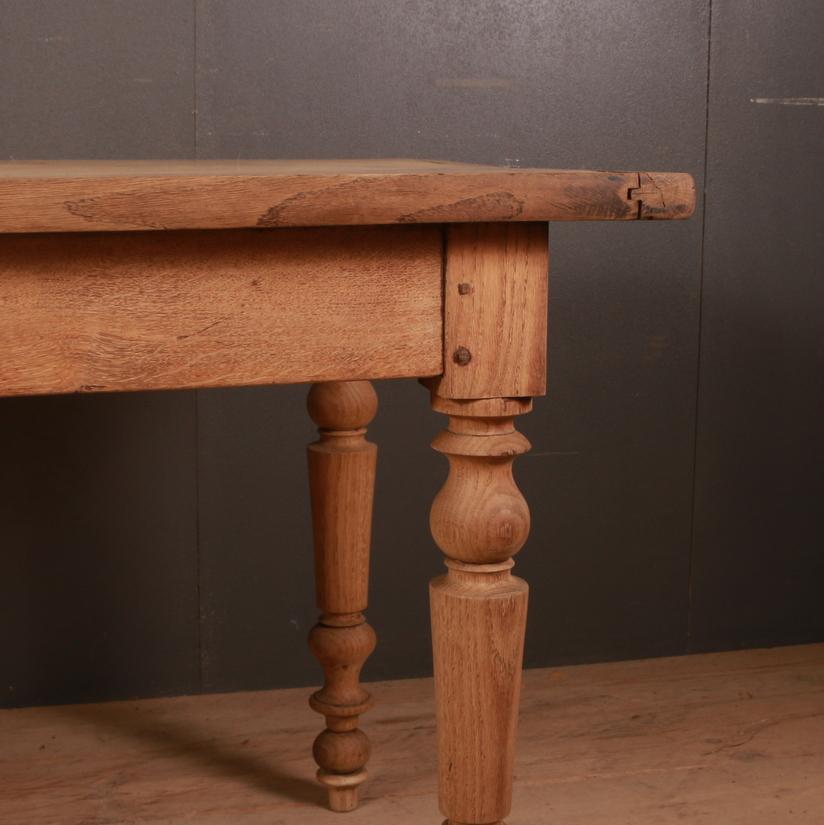 Very good 19th century bleached French oak farm table or desk. Lovely thick two board top, 1860.

Clearance under the rail - 24