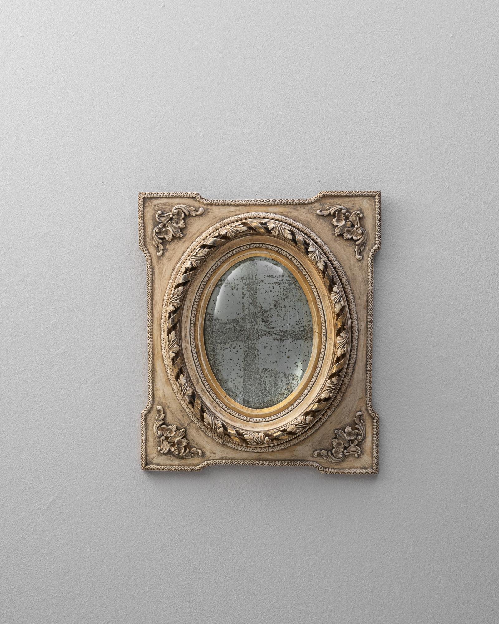 This splendid 19th-century French mirror, framed in bleached oak, is a masterpiece of ornate design and timeless elegance. The intricately carved foliage and acanthus leaves that adorn its frame exude a Baroque influence, each detail whispering of a