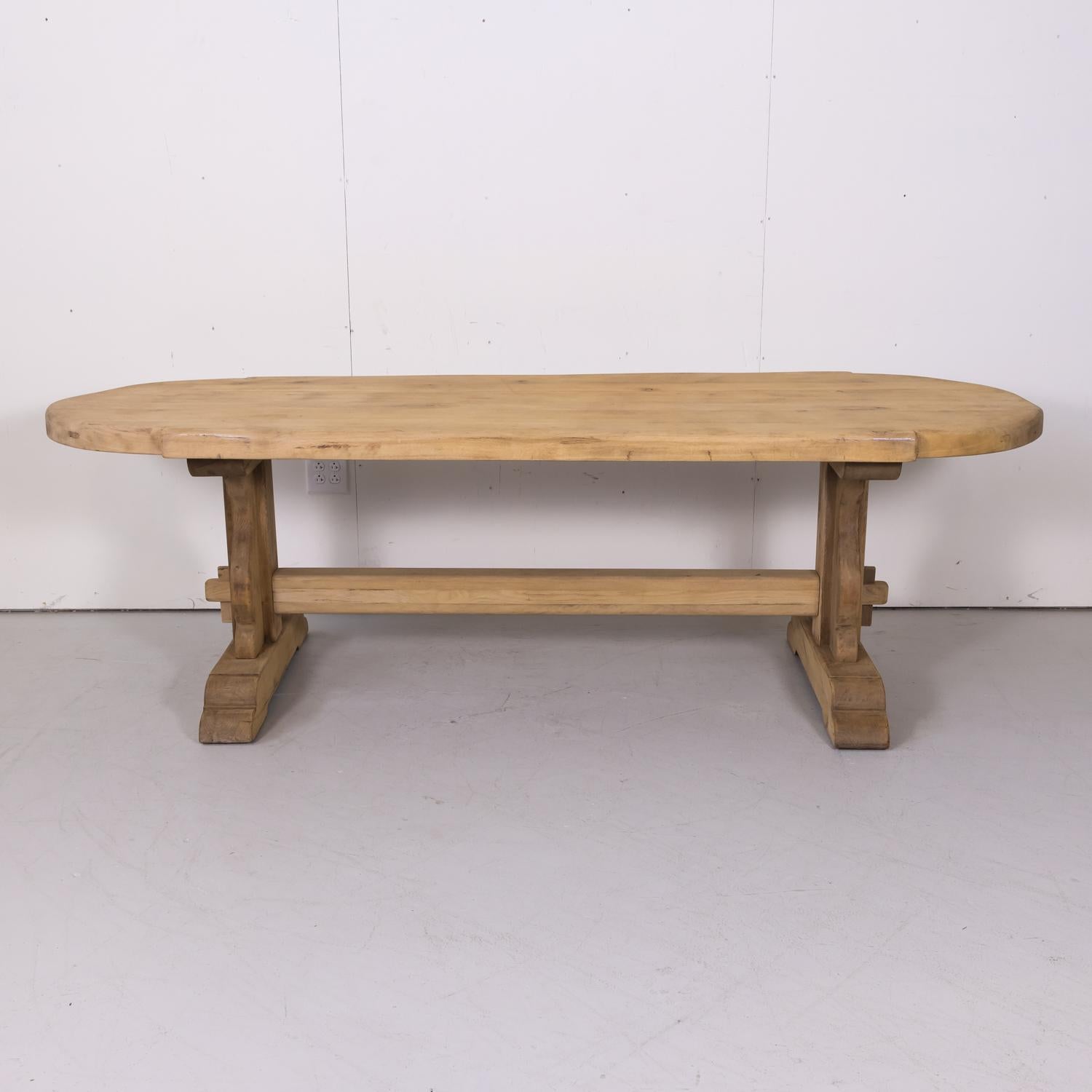 Handsome antique French bleached monastery trestle table handcrafted in Normandy of solid old growth French oak having a 2.5