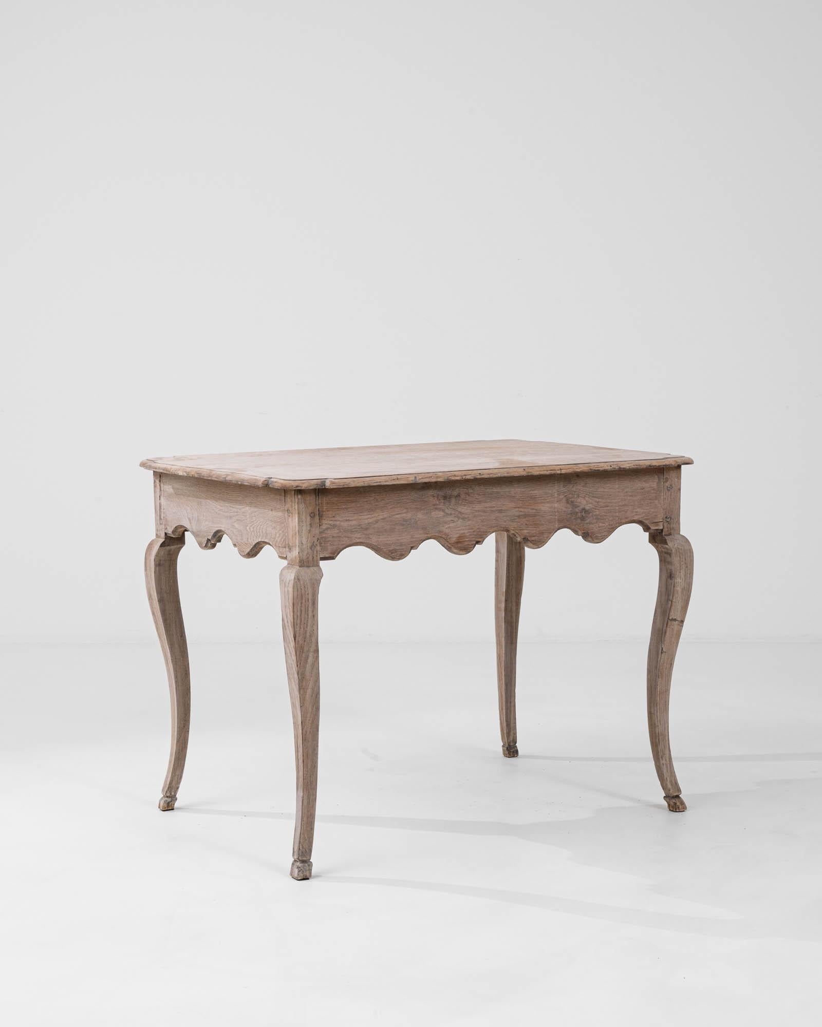 Introducing an exquisite piece of history—our 19th Century French Bleached Oak Side Table. This beautifully preserved table showcases the fine craftsmanship of its era, featuring a bleached oak finish that highlights the wood's natural grain and
