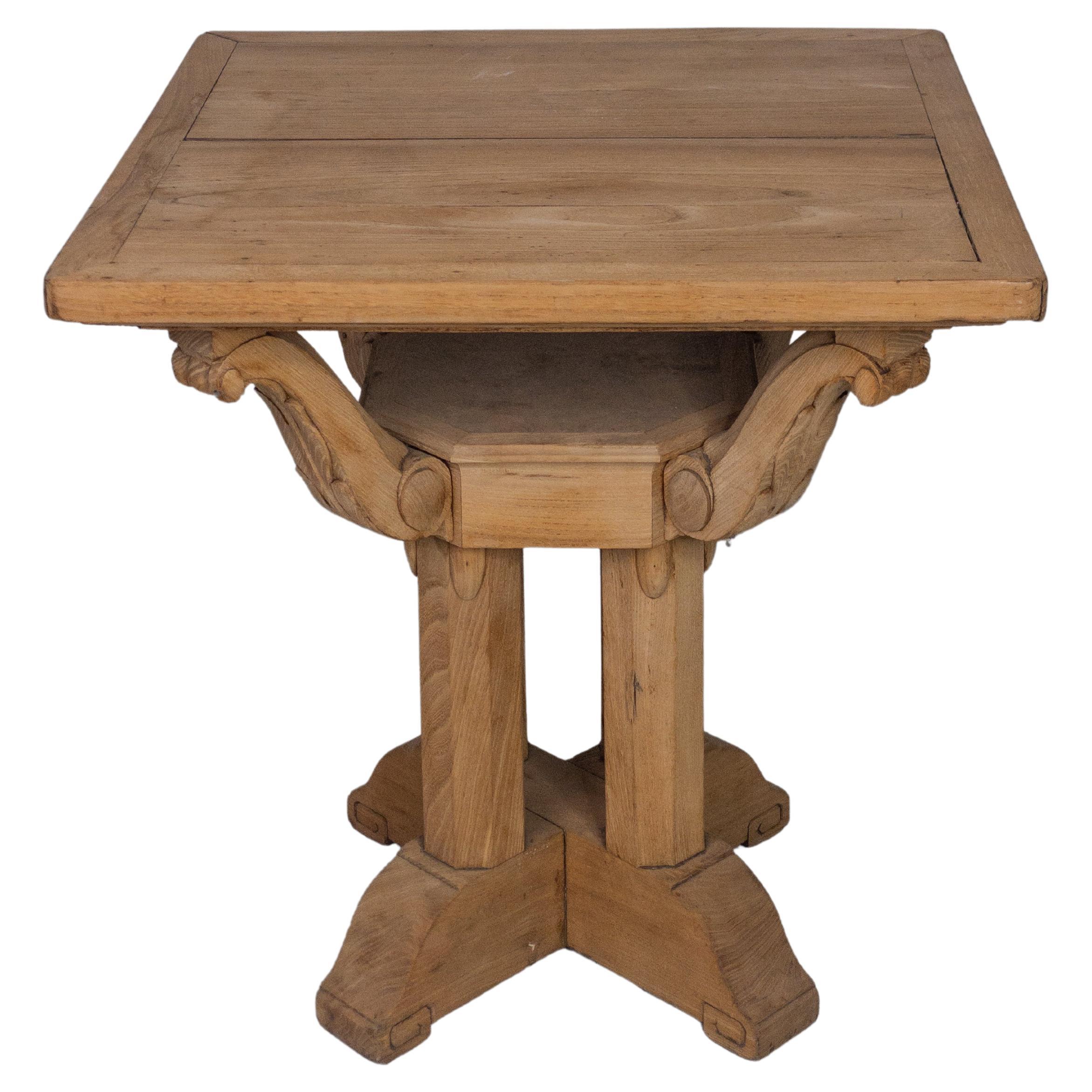 The 19th Century French Bleached Oak Table is an antique dining or occasional table originating from France during the 1800s. It is made of oak wood, which was a popular choice for furniture during that period due to its durability and attractive