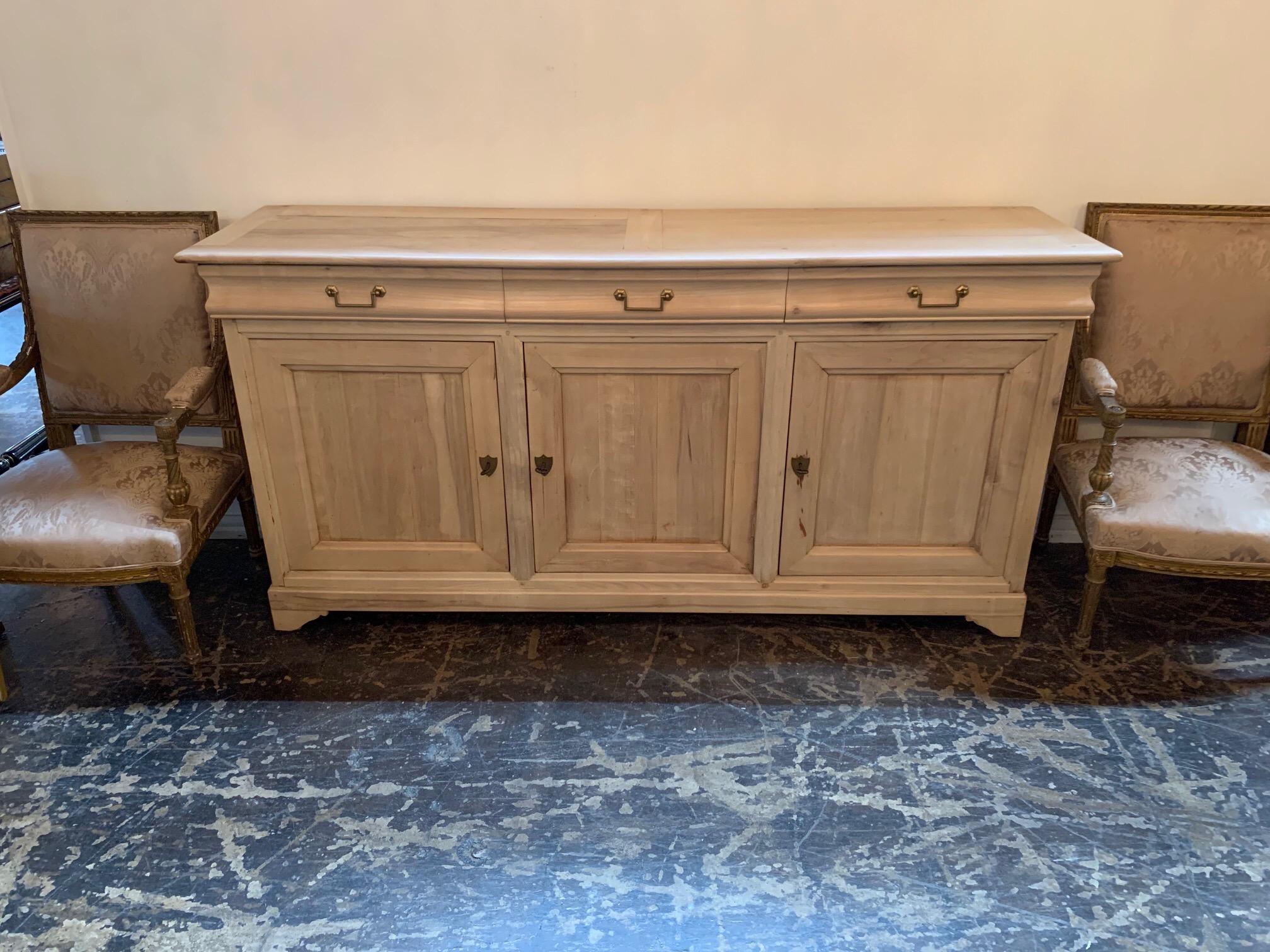 Fabulous 19th century French bleached walnut buffet. Beautiful clean lines and exceptional finish on this piece. Nice amount of storage as well. Gorgeous and great for a variety of decors!!