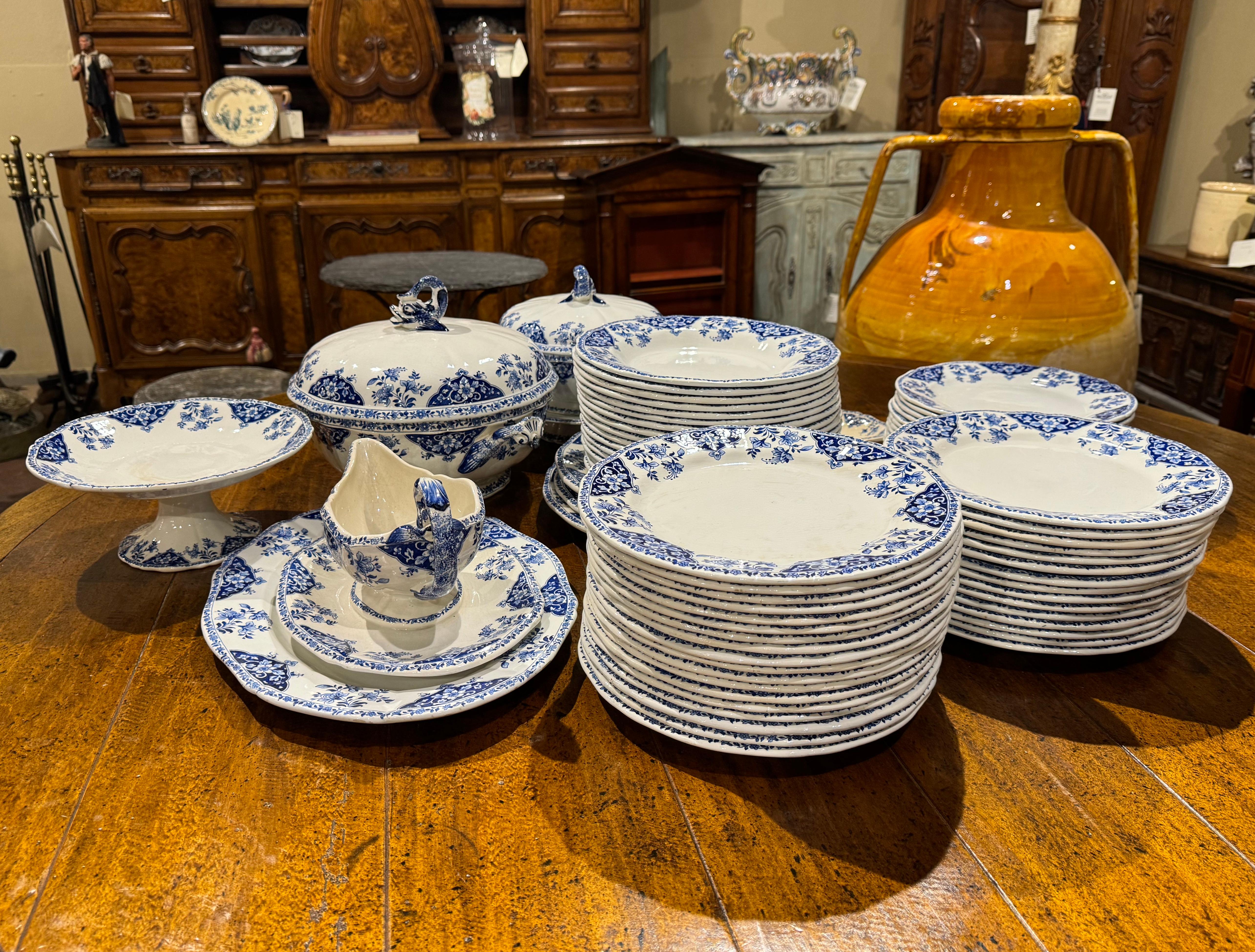 Decorate a dining table or shelving with this antique porcelain service set of 77 pieces. Crafted in France circa 1880 by Gien, each plate and dish with foliate and floral motifs, is stamped on the bottom 