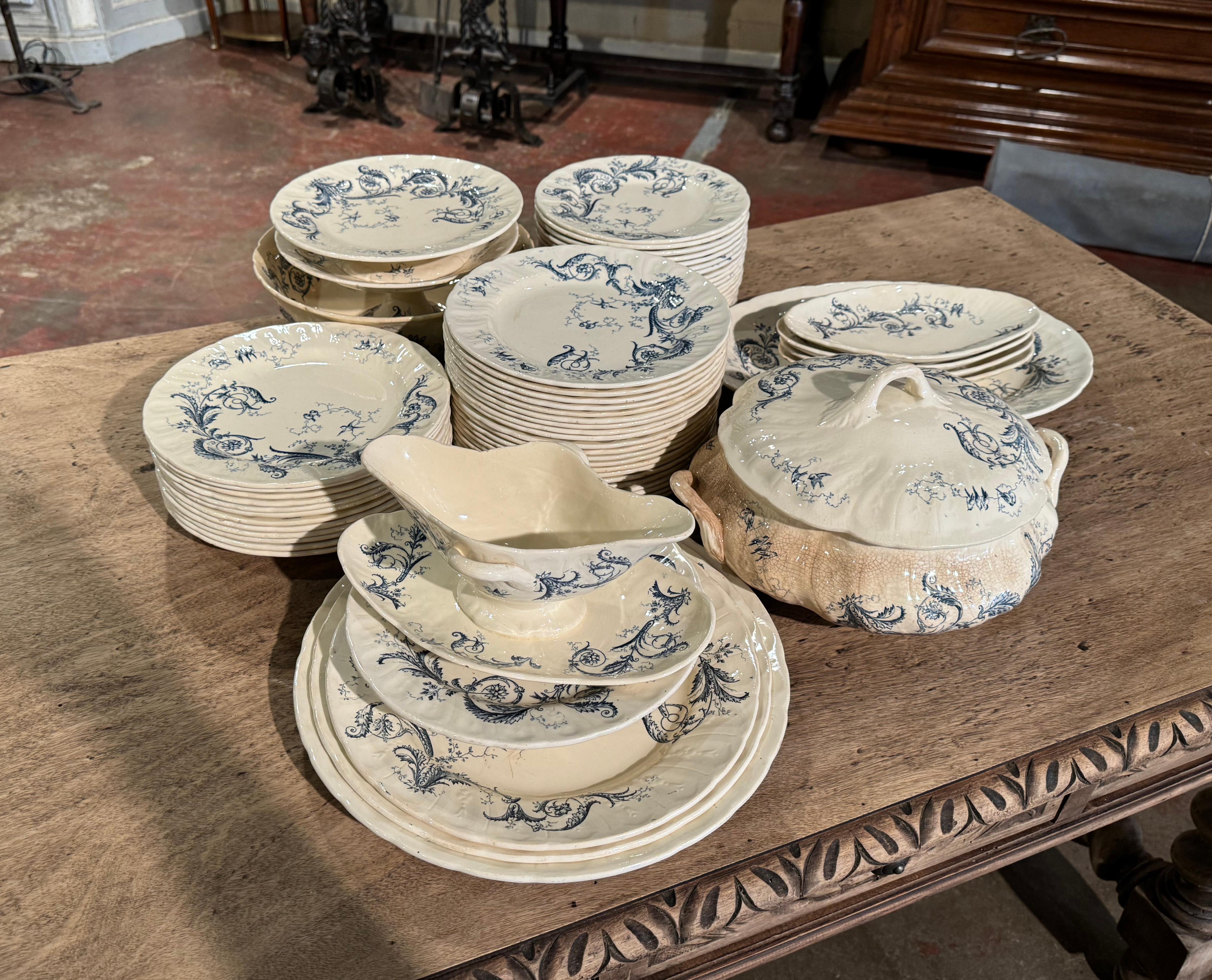 Decorate a dining table or shelving with this antique porcelain service set of 67 pieces. Crafted in France circa 1880 by Gien, each plate and dish with foliate and floral motifs, is stamped on the bottom 