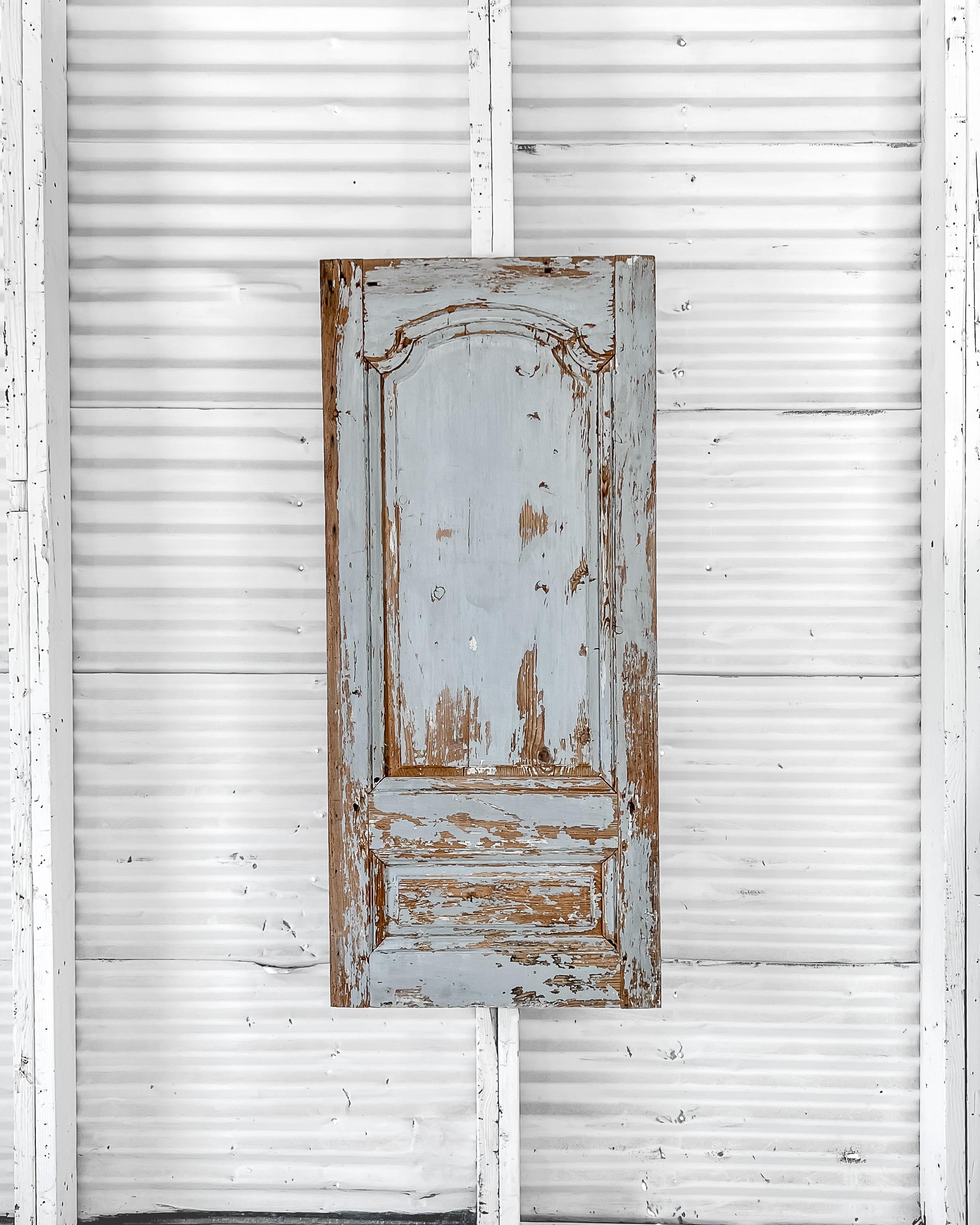 A beautiful mid-19th century, decorative provincial architectural wood wall panel with original worn “French blue” paint.

Enhance an empty wall with this wonderful work of art to add architectural interest and a sense of history to your modern
