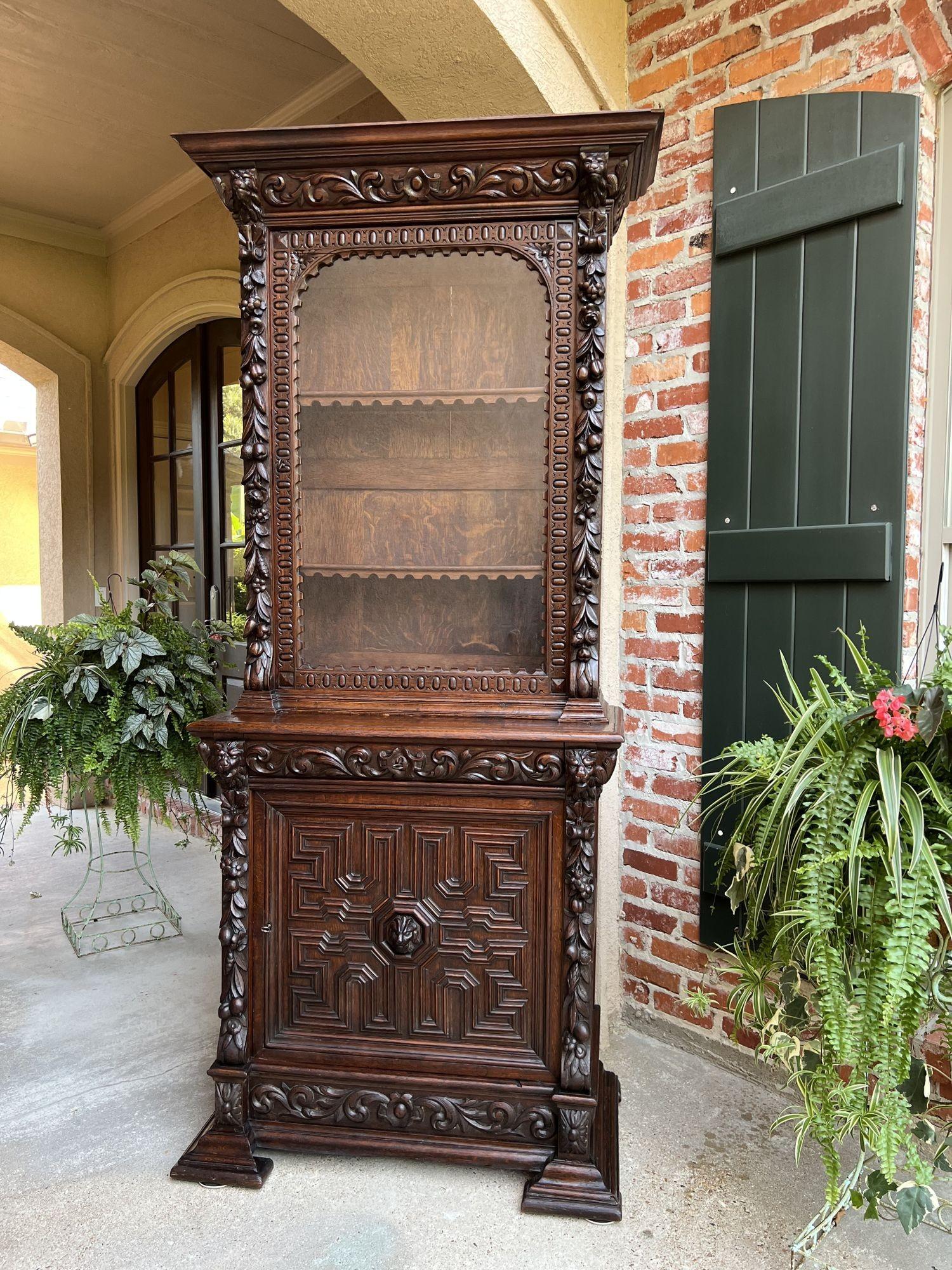 Superb 19th century Antique French Dark Oak “Hunt Cabinet”, Bookcase, Vitrine or Display Cabinet!
 
Direct from France, and one of several exquisite glass door bookcase/cabinets from our most recent container. Wonderfully hand carved oak pieces in