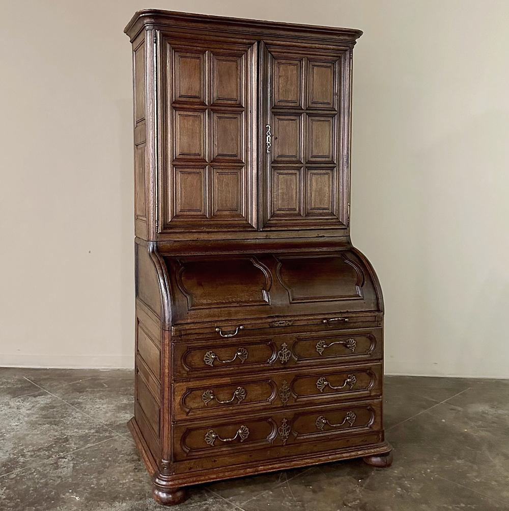 19th century French Bookcase ~ Cylinder Secretary is a stately reminder of a bygone era! Hand-crafted by talented cabinetmakers from a mixture of indigenous and imported woods, it features a stately neoclassical architecture with a bold multi-tiered