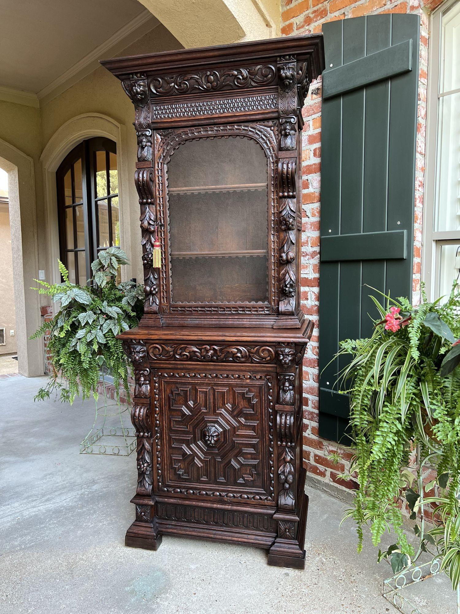 Superb 19th century antique French dark oak “Hunt Cabinet”, Bookcase, Vitrine or Display Cabinet!
 
Direct from France, and one of several exquisite glass door bookcase/cabinets from our most recent container. Wonderfully hand carved oak pieces in