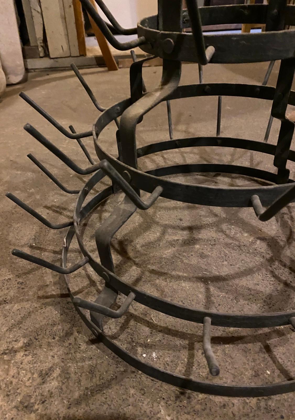 Late 19th century bottle drying rack with six tiers. 60 bottles.  These racks were used in vineyards to dry used wine bottles. Use it to hang coffee cups, jewelry, drying herbs. Will also make a great store fixture for displaying knick knacks.  A