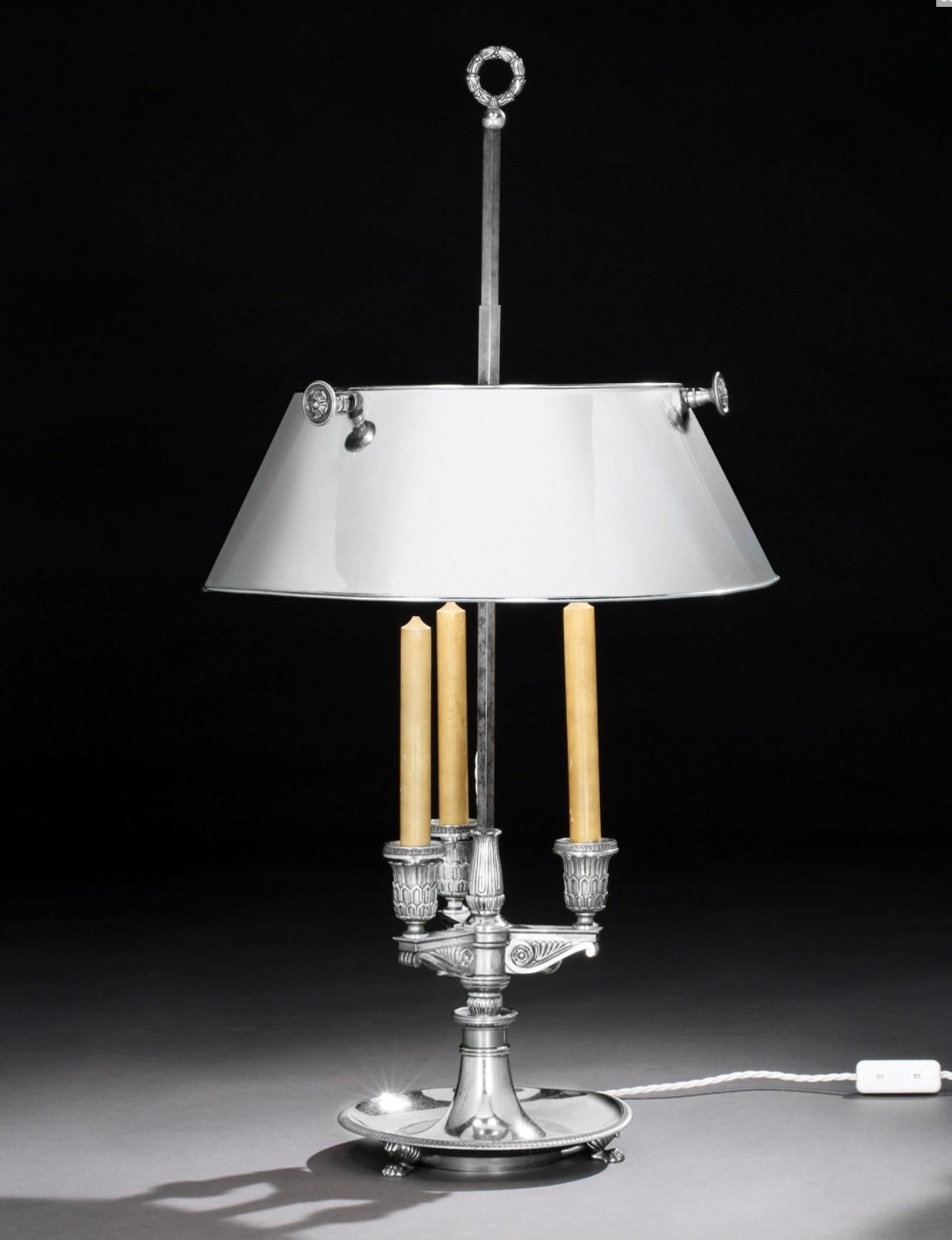 A fine polished steel late 19th century French bouilotte lamp. Wired for electricity - the bulbs hidden within the shade.
Faux candles, and particularly fine quality metalwork. The shade height adjustable. Neo-classical in taste.
Measures: