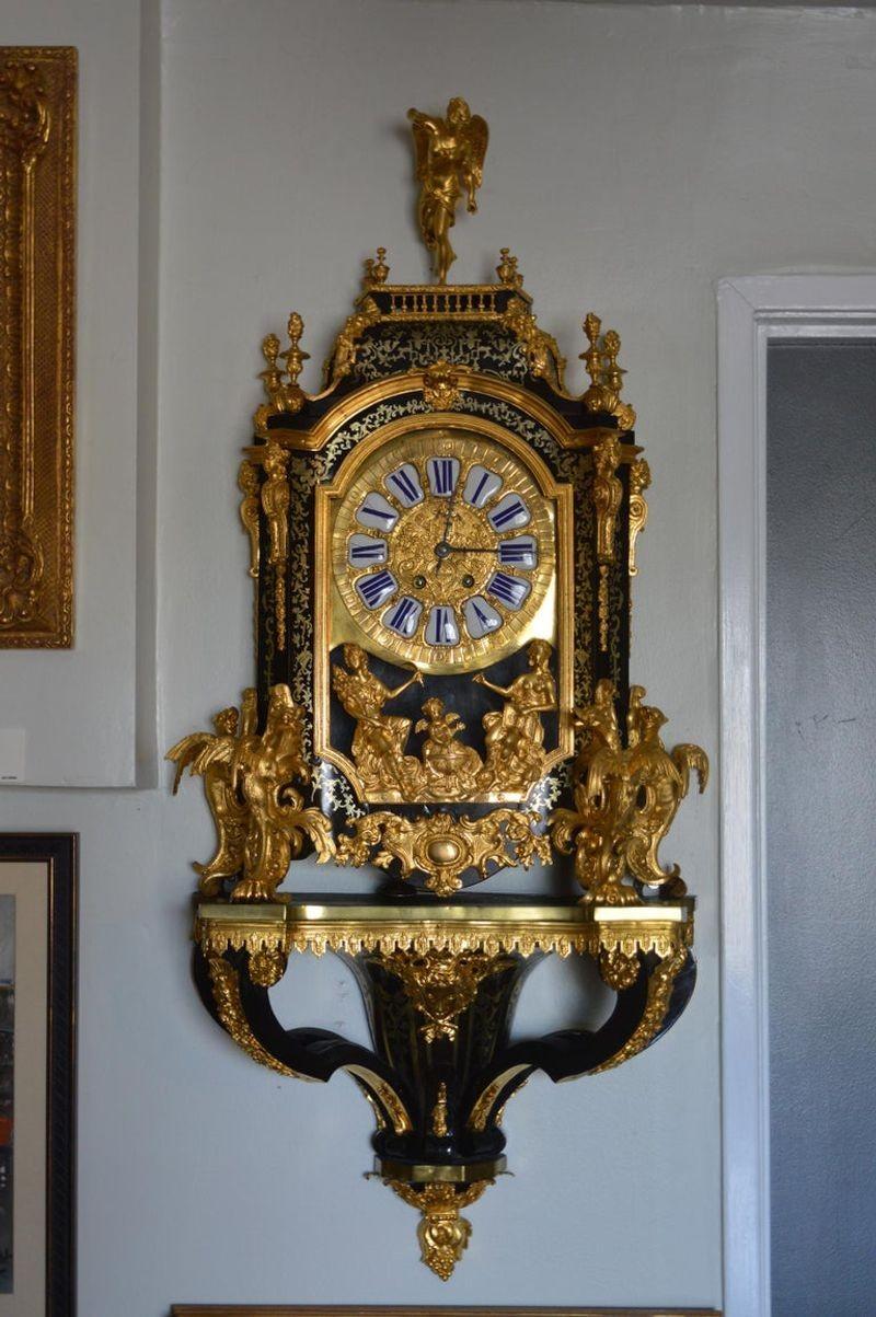 19th century French Boulle clock with pedestal. Working condition. Details of dragons at the base of the clock and Angel at the top.
