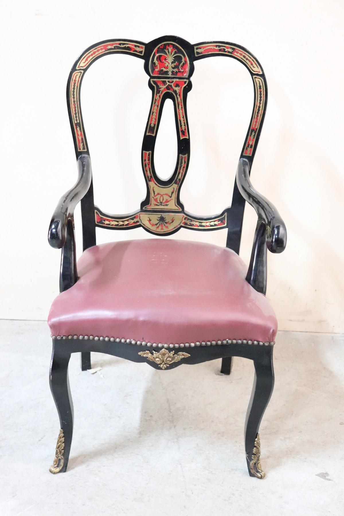 Rare and fine quality antique French Louis XV style boulle, 1880s red tortoiseshell and brass inlaid pair of armchairs. The two armchairs have different decorations probably because one intended for women and the other for men. Used conditions.