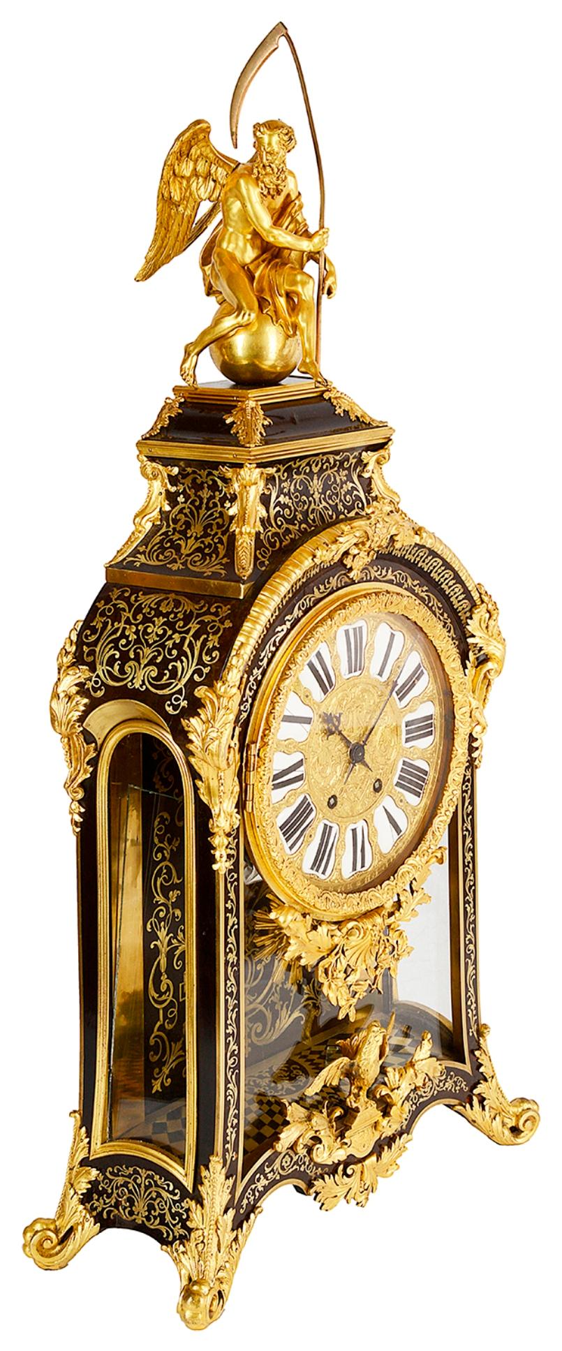 A very impressive 19th century French Boulle inlaid mantel clock. Having a gilded ormolu figure of father time to the top, beautiful brass inlaid decoration to the sides and front. The enamel roman numerals to the clock face, an eight day chiming