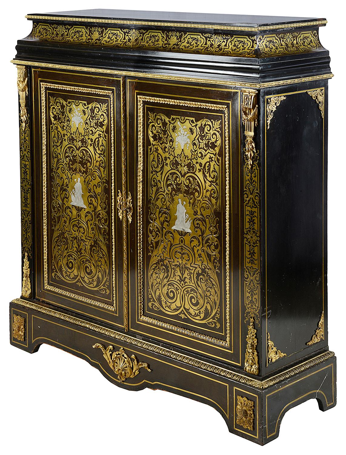 A good quality 19th Century French Boulle brass inlaid side cabinet, having classical scrolling foliate and swag decoration, gilded ormolu mounts, Pewter inlay to the centre of the doors, depicting classical figures. The pair of doors opening to