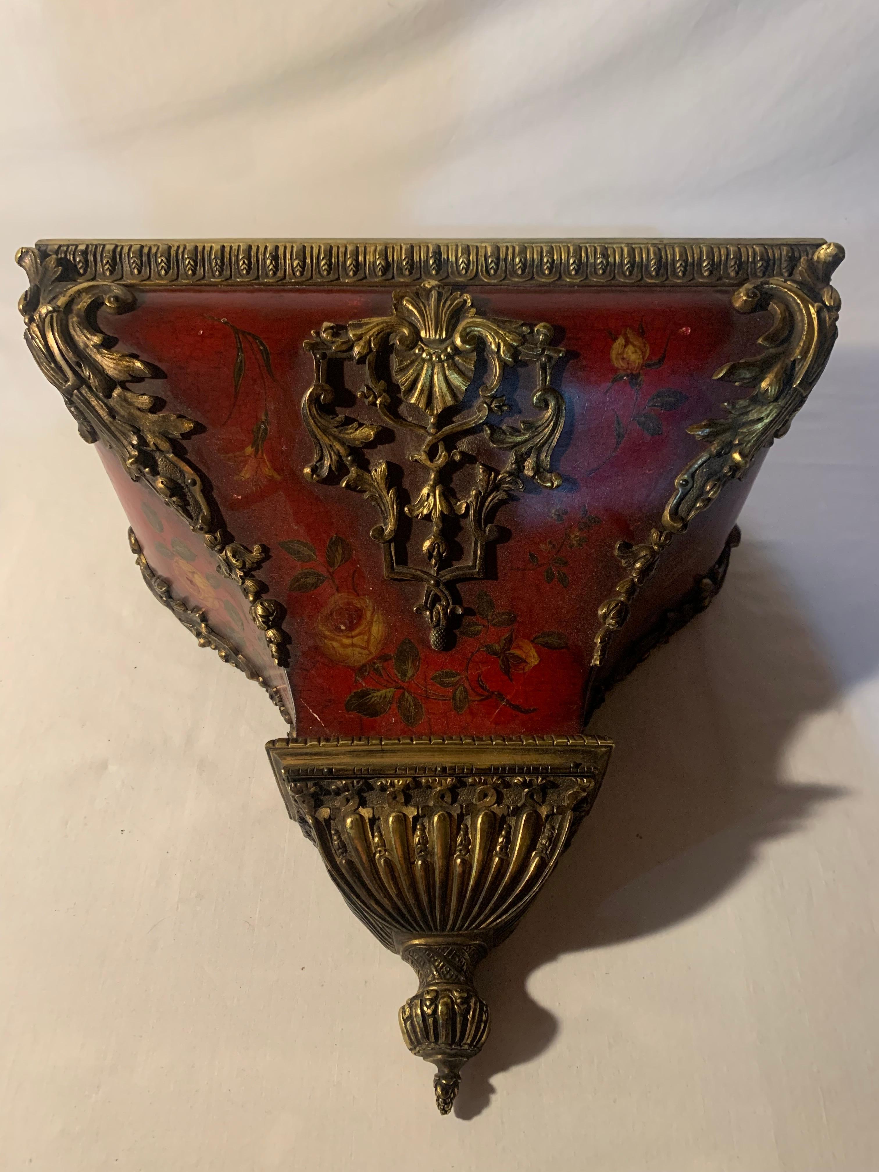 A beautiful bracket clock on wall stand, Red Lacquered, Chinoiserie case, Gilt details, Porcelain face, Bronze trim, early 19th century French.