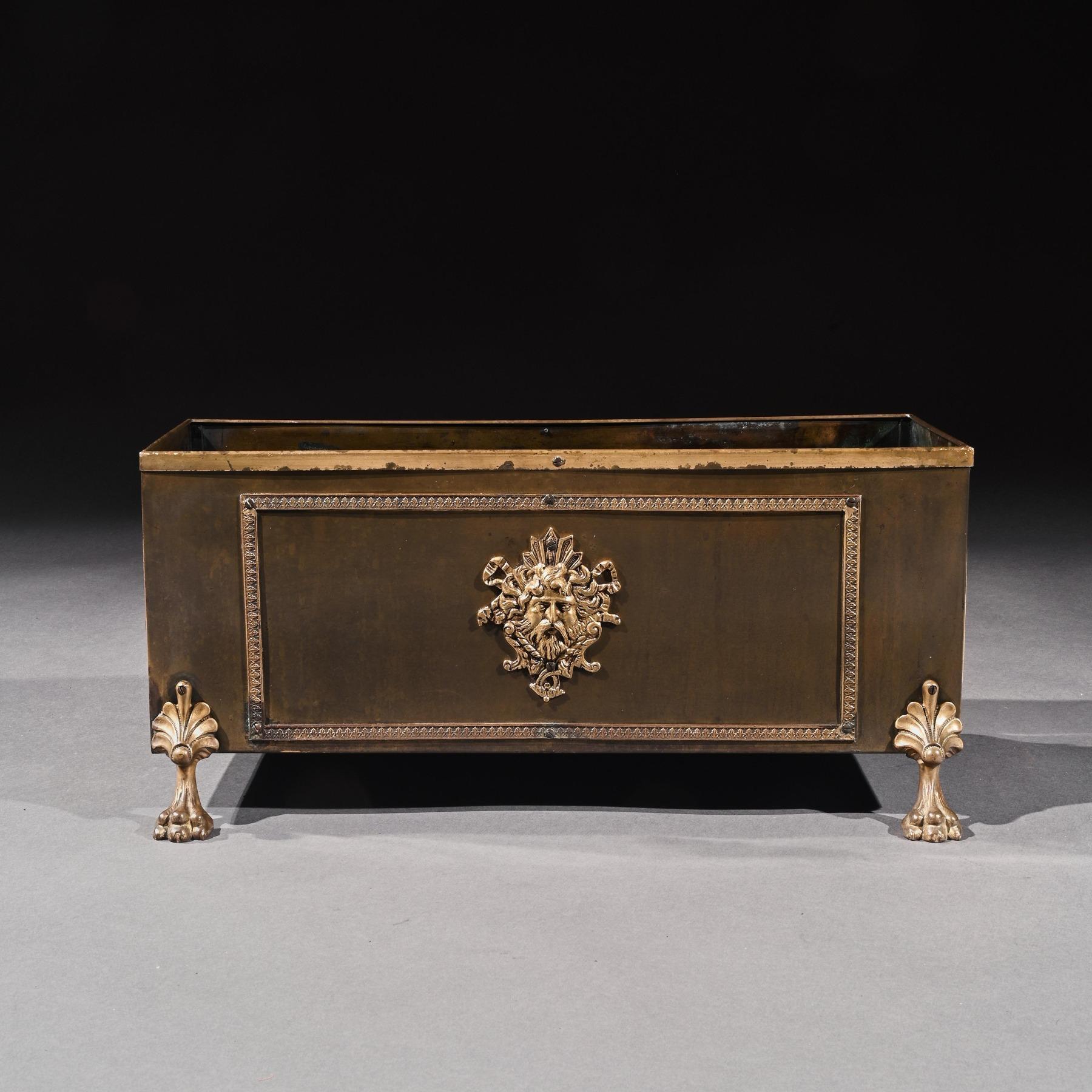 A good French late 19th century copper and brass-mounted table planter jardinière.

French, circa 1880.

Of copper structure the rectangular form body having a brass lipped edge and moulded panels with lion ring handles to each end and central