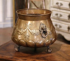 19th Century French Brass Cache-Pot with Lion Head Handles and Repousse Decor