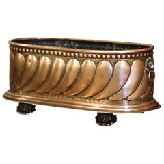 19th Century French Brass Cache-Pot with Lion Head Handles and Repousse Decor