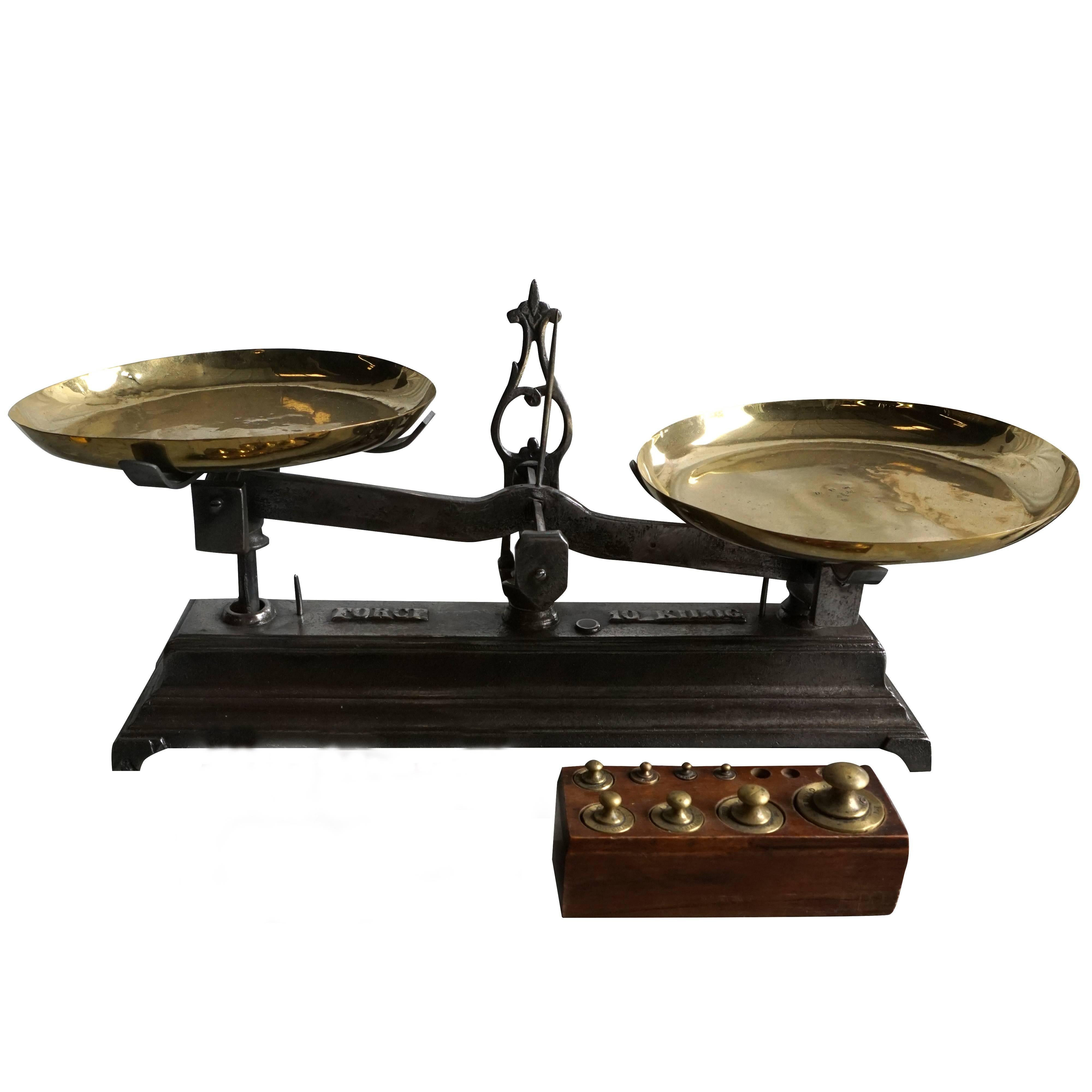 Mid-19th century, an intricately detailed scale with brass plates. The top of the scale it says 