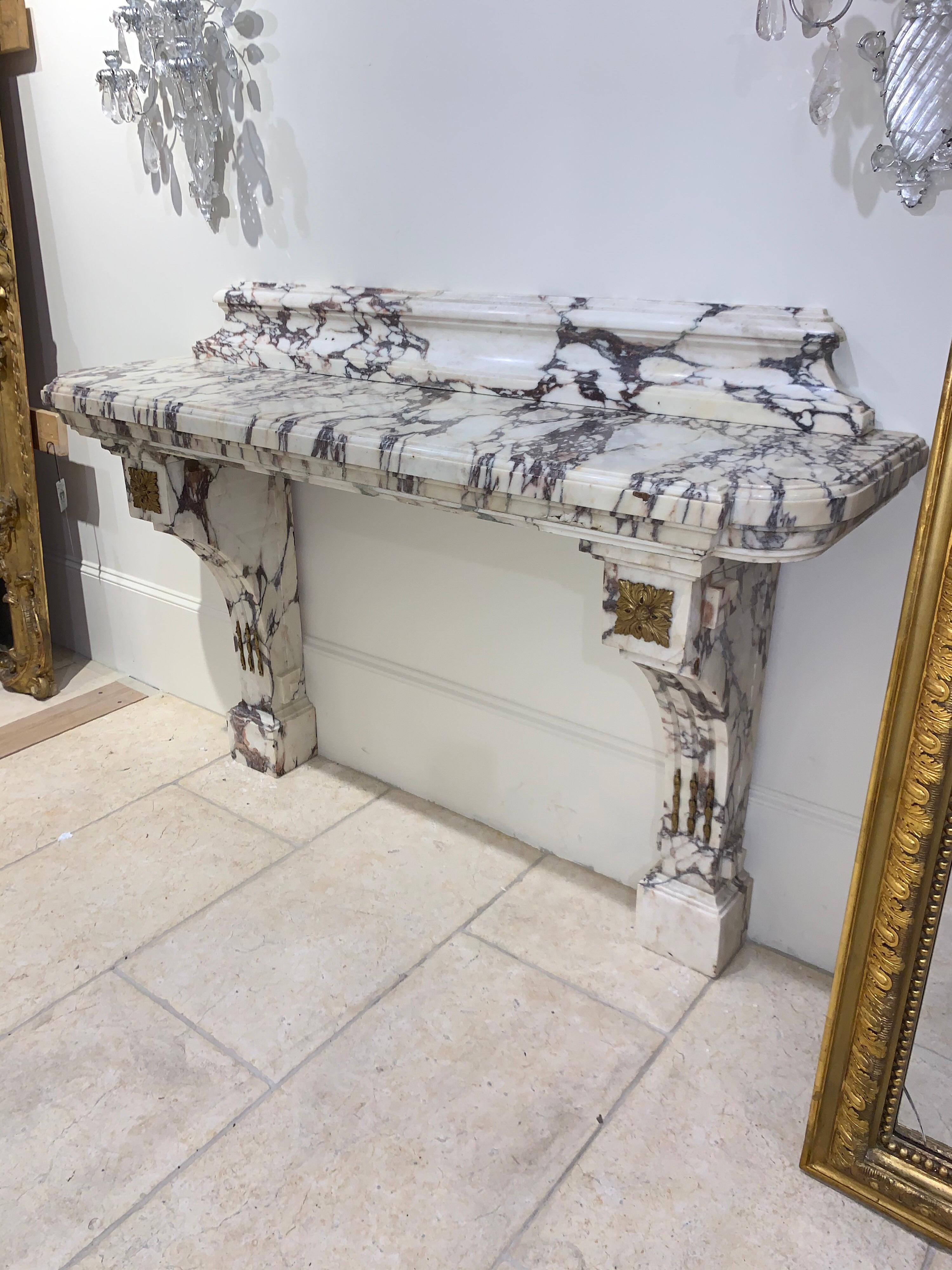 Exquisite early 19th century French Breccia Violetta marble console with bronze mounts. This solid marble piece makes a very impressive statement. Perfect for an elegant home!