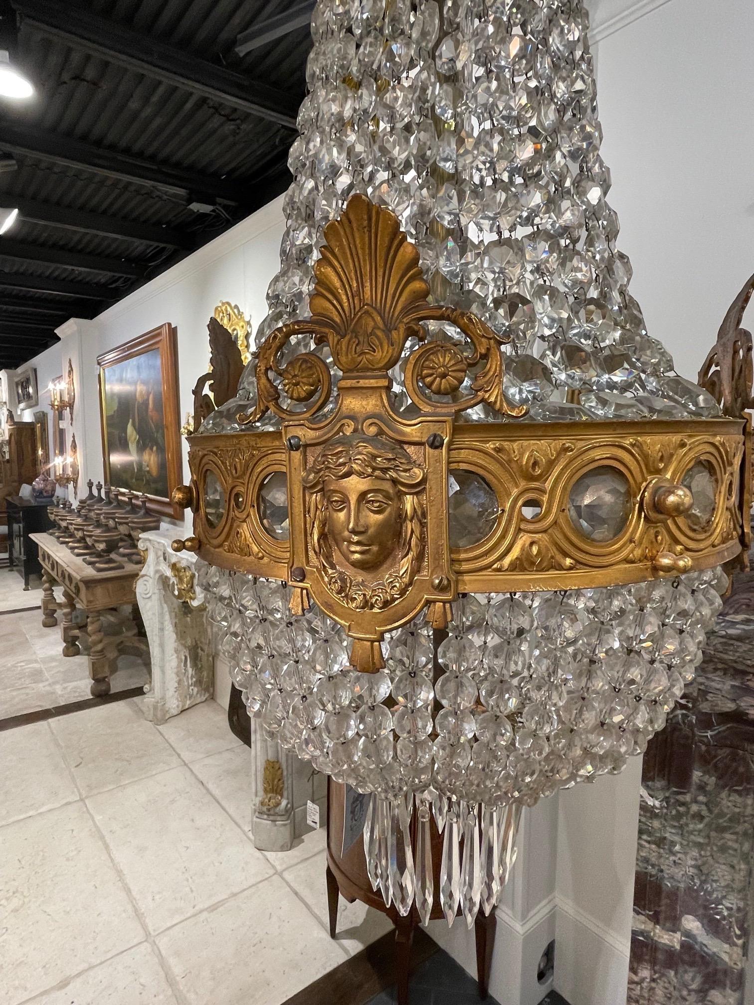 Very fine 19th century French bronze and crystal basket chandelier. Featuring gorgeous crystals and pretty designs on the bronze including a women's face. Beautiful!
