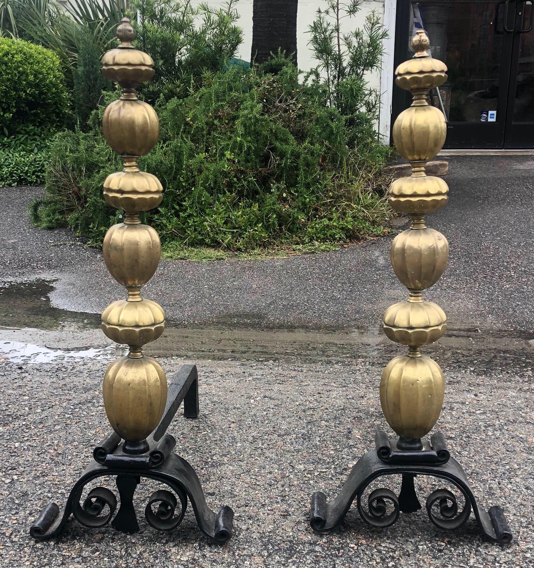 Great pair of 19th century French bronze and iron andirons with faces etched into the finials.