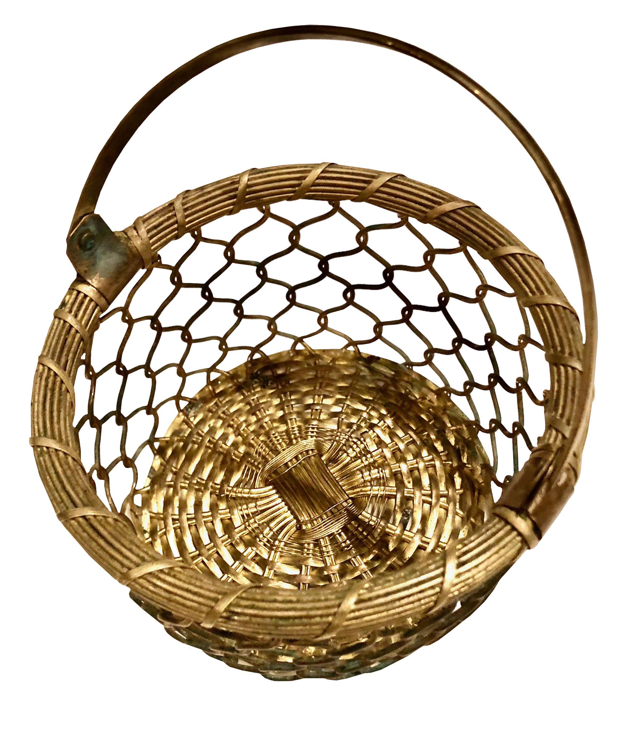 A lovely antique solid bronze basket from France. Will display beautifully among holiday table decor or as a stand alone piece. Circa 19th century.  The basket is three and a half inches deep. 
