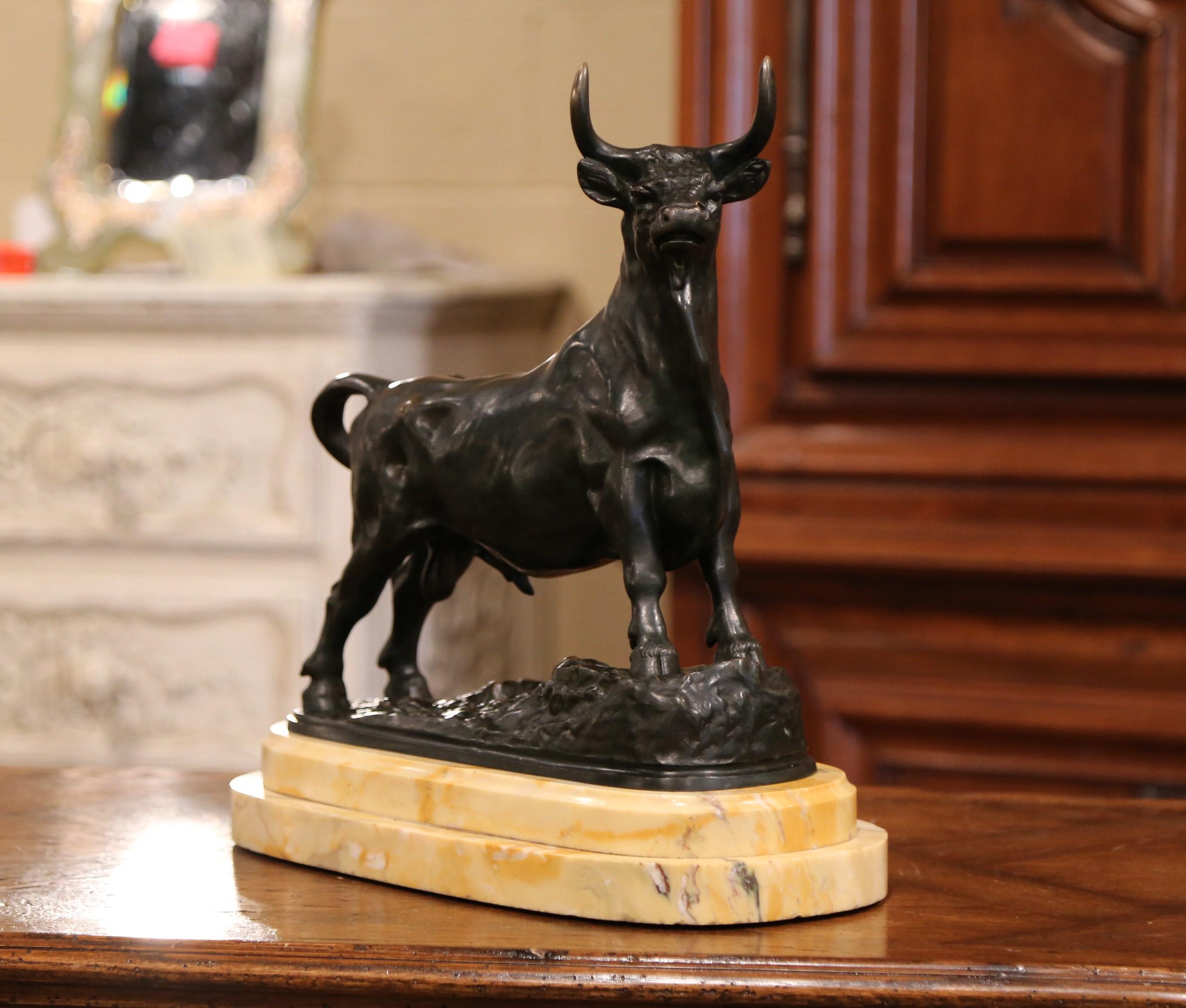 Crafted in France, circa 1860 and beautifully executed, the patinated bovine figure is shown standing a carved beige marble slab, looking defiant and proud with a calm but attentive attitude. Signed on the base by the artist, Auguste Clesinger, the