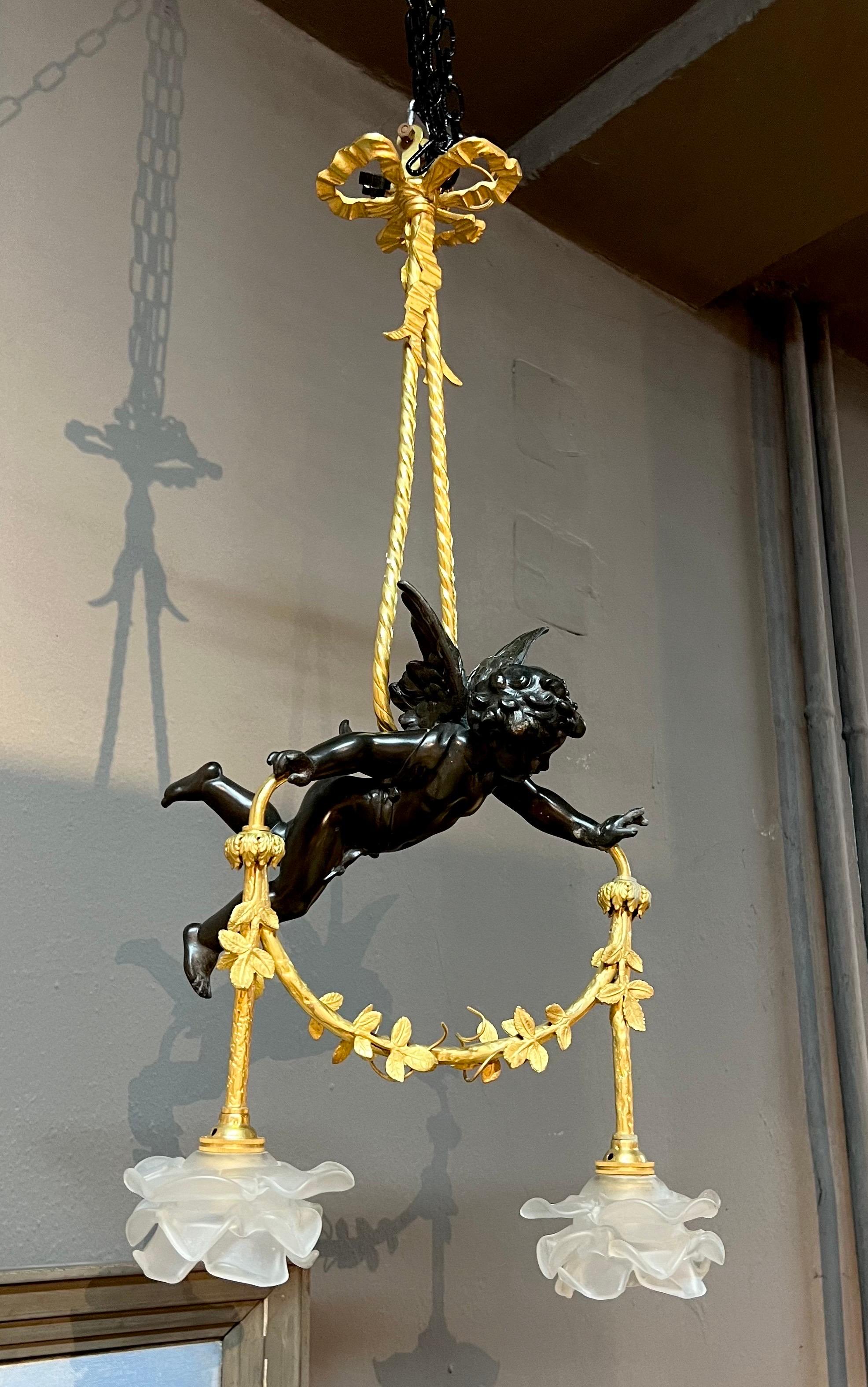 19th Century French bronze chandelier in Louis XVI style, with two hand made crystal roses and a black putty holding them. The piece is in very good authentic condition hard wired with two bulbs.
France, circa 1860 