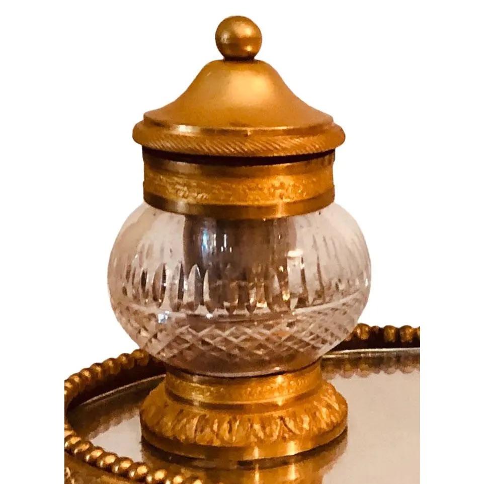 A doré bronze and marble inkwell. It is French in the Empire style. Compartments have their little glass containers for ink and are all original.