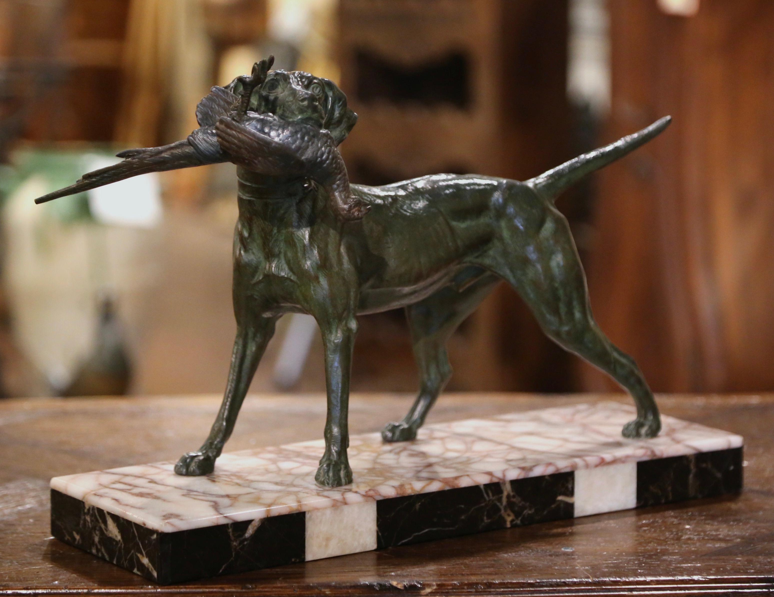 Decorate your study or mantel with this beautifully executed hunt composition. Crafted in France, circa 1870 in the style of French sculptor Jules Moigniez, the expressive figure sits on a black and grey marble slab base; the spelter subject depicts