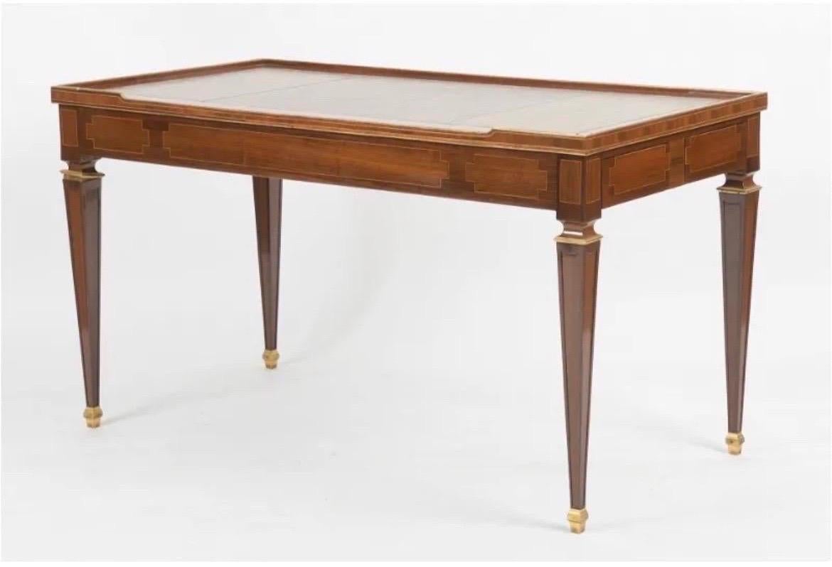 19th Century French bronze mounted leather top writing desk / tric trac table featuring a removable top that has an inset tooled leather desk on one side and a baize lined card playing surface on the other. When the top is removed, the recessed