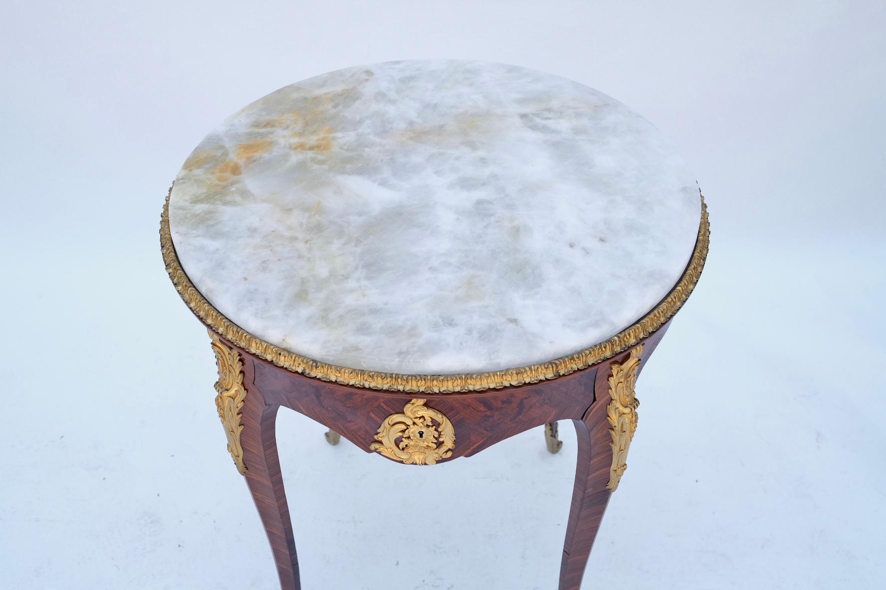 Fine 19th Century. French. Bronze-mounted. Single drawer. Rock crystal stone top. Chasing on the bronze is very fine. Cannot find signature.