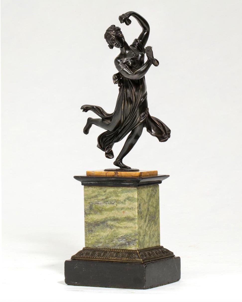 A French patinated bronze and marble model of a castanets dancer, late 19th century.