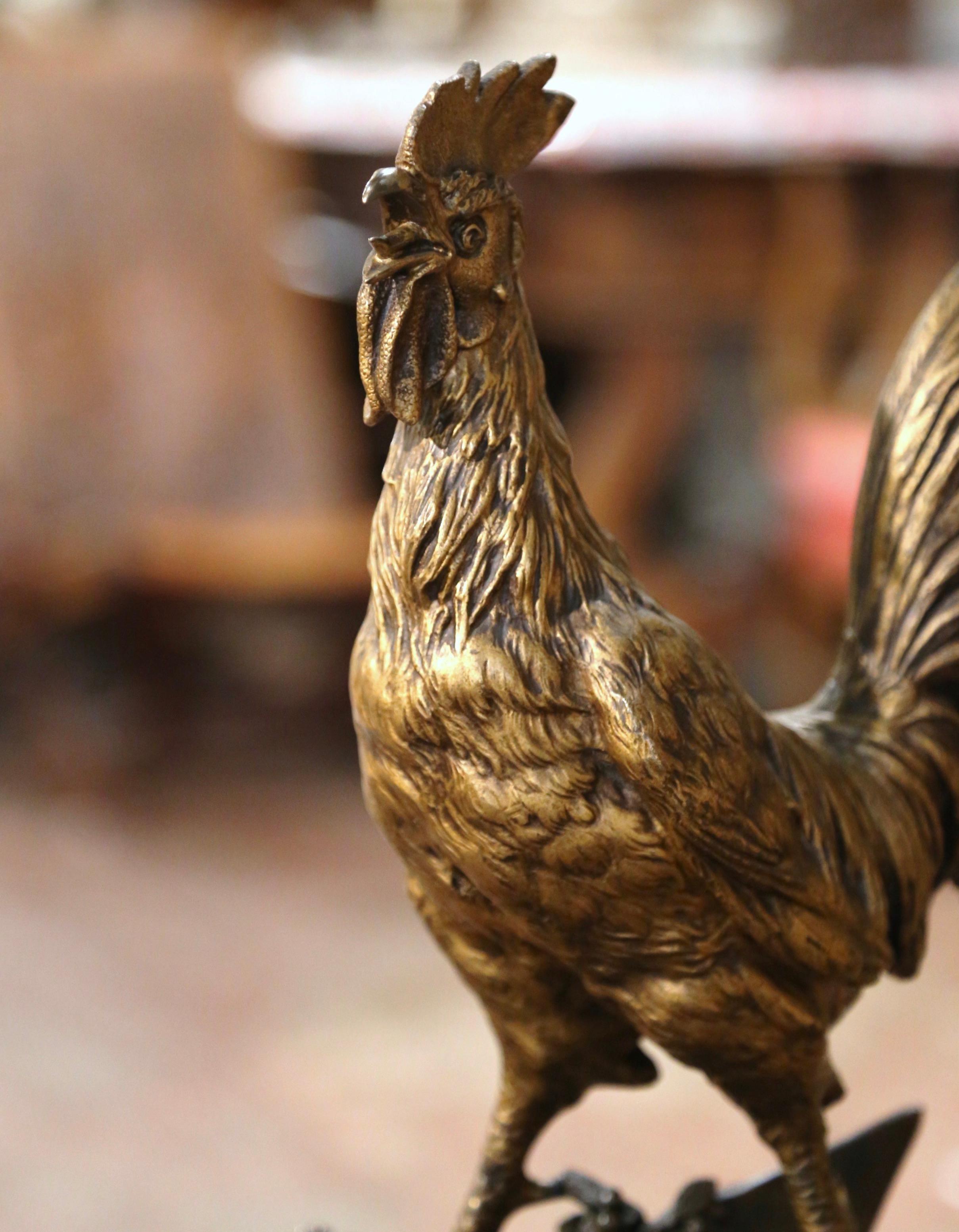 Decorate an office or a study with this lovely antique rooster figure. Sculpted in France circa 1880, and a traditional symbol of France, the bronze chanticleer is signed by the artist E. Drouot. The proud rooster is shown standing on a rocky base