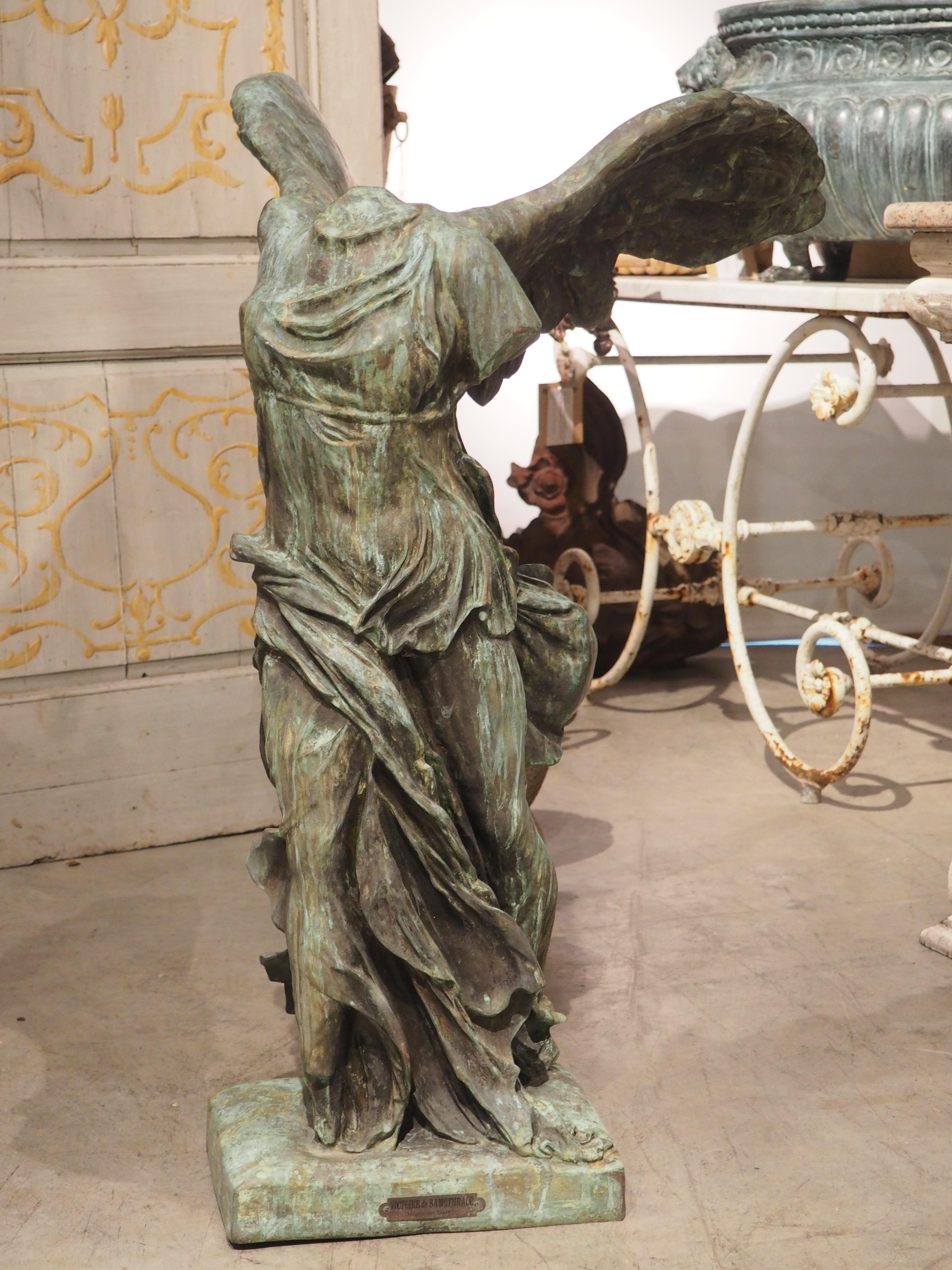 headless sculpture with wings