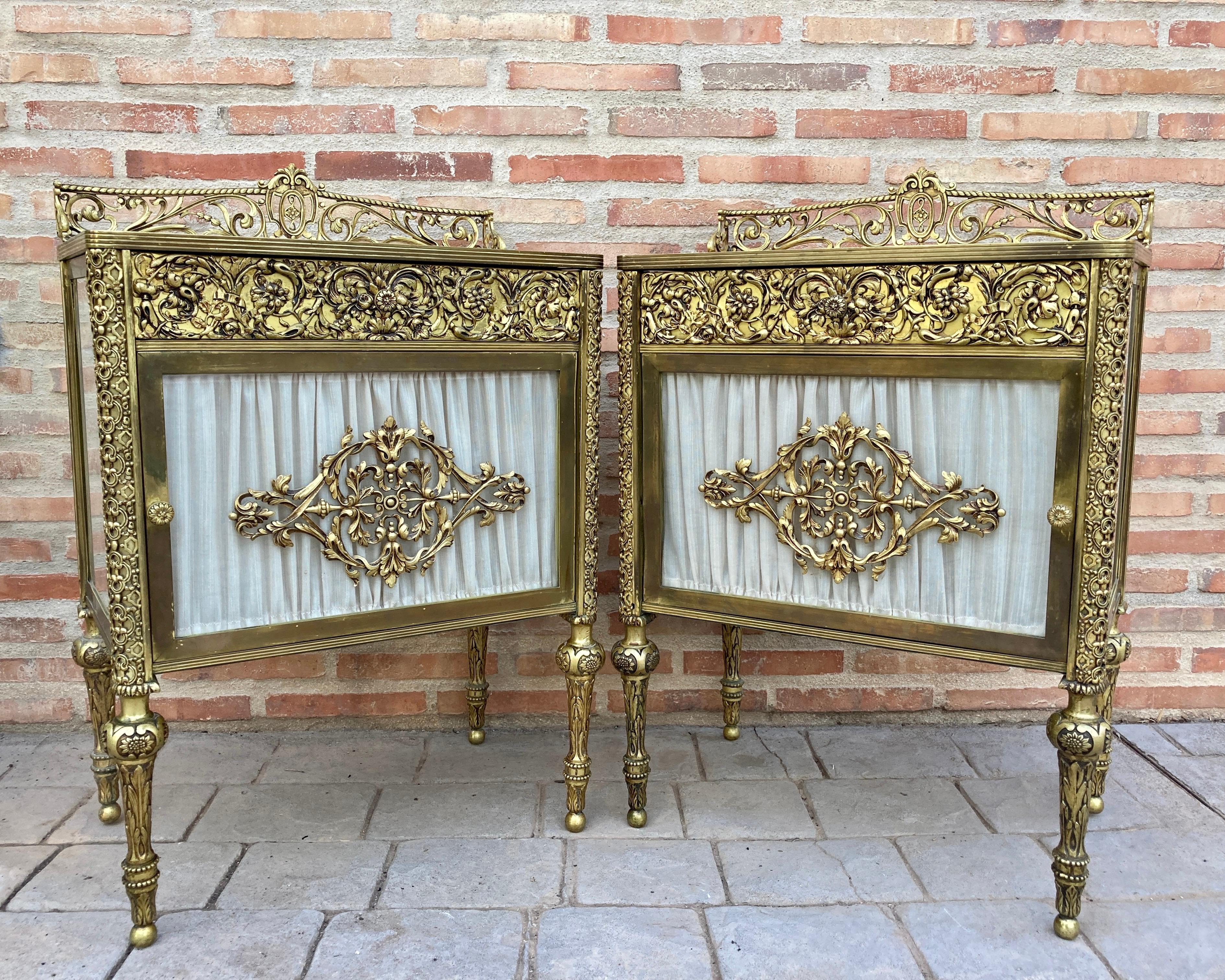 Pair of 19th century bronze and mirror bedside tables with a central brass drawer.

These late 19th century Bronze and Glass Belle Époque Cabinets or Nightstands are simply stunning and built to the highest standard. The bronze is finely mounted