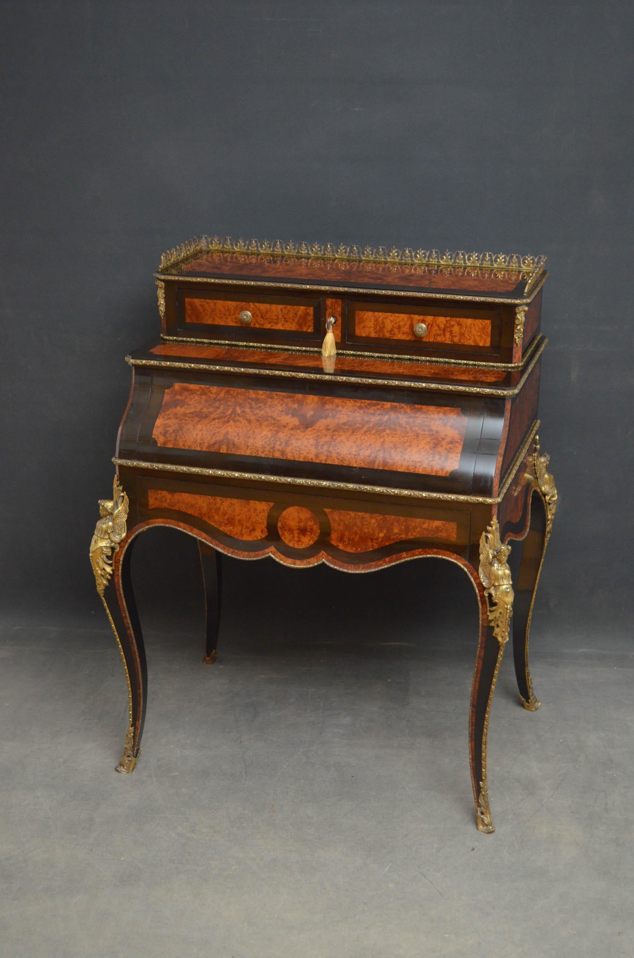Sn4737, a superb French bureau du Jour in amboyna, having brass gallery to top, 2 mahogany lined drawers and a shaped fall which opens to reveal black leather writing surface and small drawers above a frieze drawer, standing on cabriole legs with
