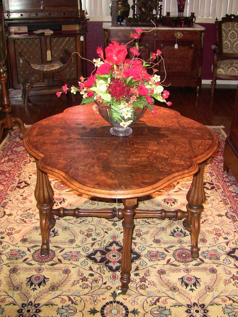 Late 19th century English drop-leaf table from the Mid-Victorian Era.

Made of gorgeous yellowish-brown walnut with a fantastic burl walnut table top. The patina on the top is simply glorious!!

The table was made circa 1850-60.

It sits on