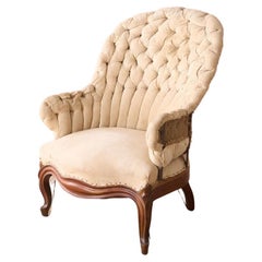 Used 19th century French buttoned iron back armchair