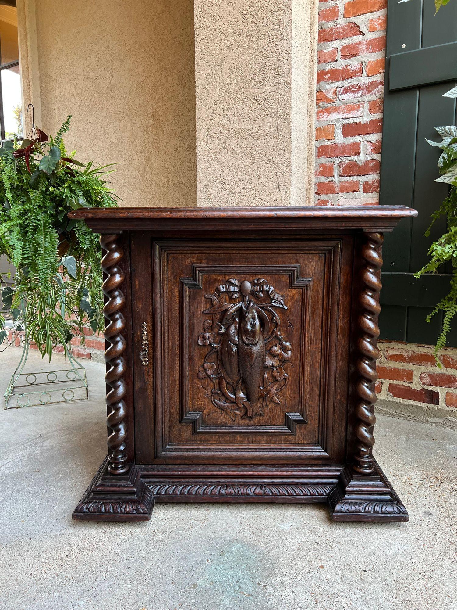 19th Century French hunt cabinet barley twist black forest wine bar carved oak.
 
Directly imported from France, a beautifully hand carved 19th century French confiturier cabinet.
These cabinets are one of our most requested antiques, as they have