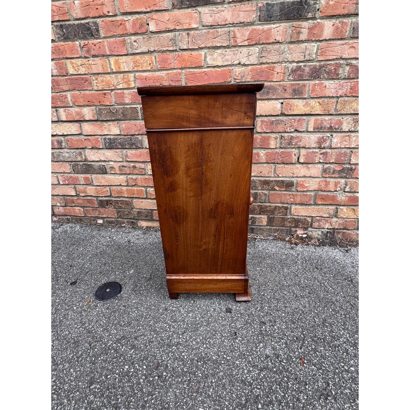 This is a beautiful little antique cabinet! Small and simple and yet so appealing, this piece dates to the 19th century and is from France. The wood has a soft glow from its patina and the natural tone and detail of the wood shows up nicely. The