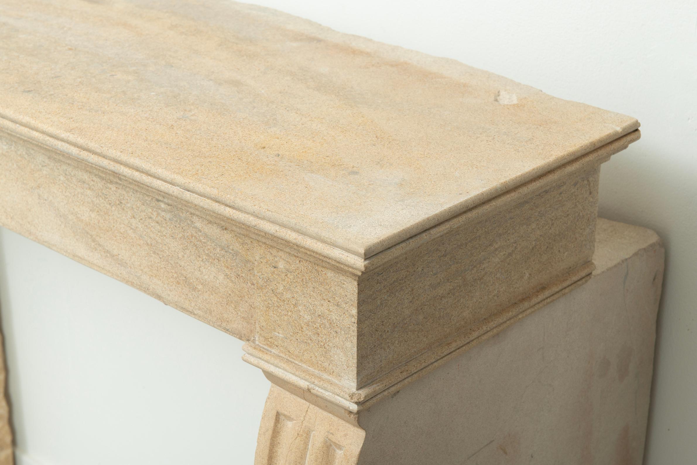 19th Century French Campagnard Limestone Fireplace with Sculpted Scroll Jambs For Sale 9