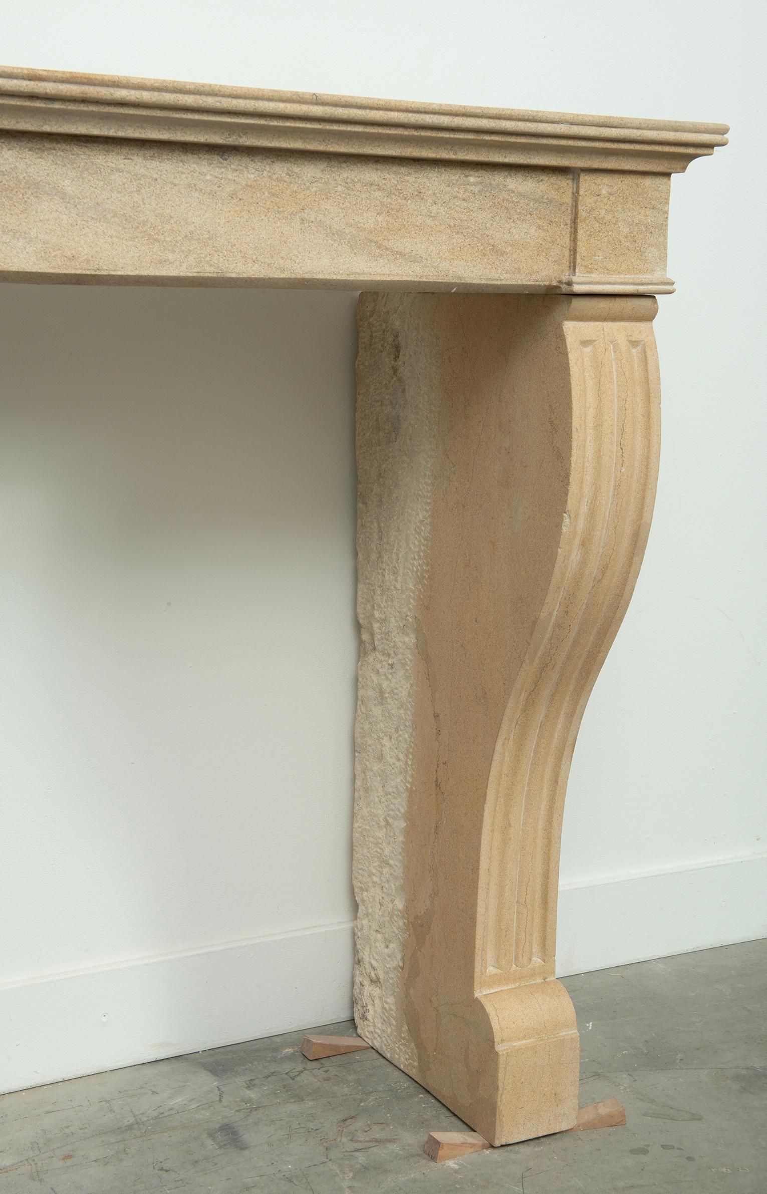 19th Century French Campagnard Limestone Fireplace with Sculpted Scroll Jambs For Sale 10