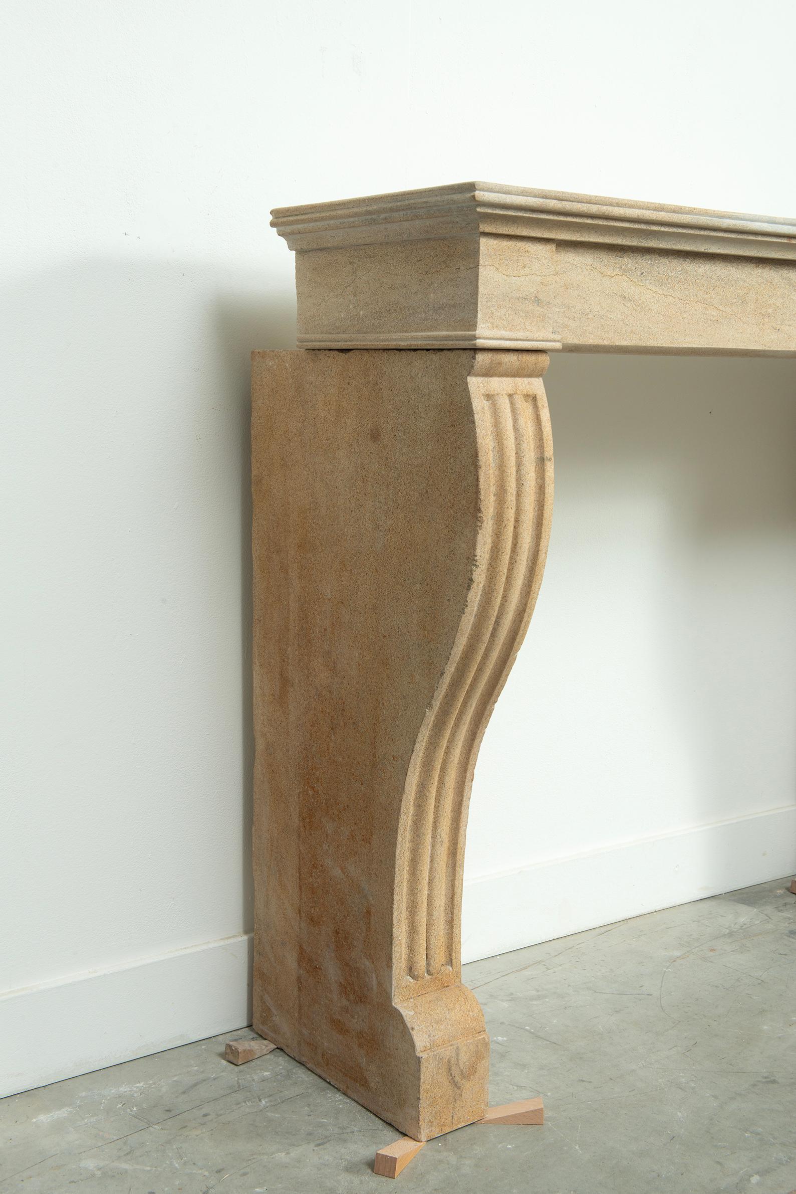 19th Century French Campagnard Limestone Fireplace with Sculpted Scroll Jambs For Sale 14