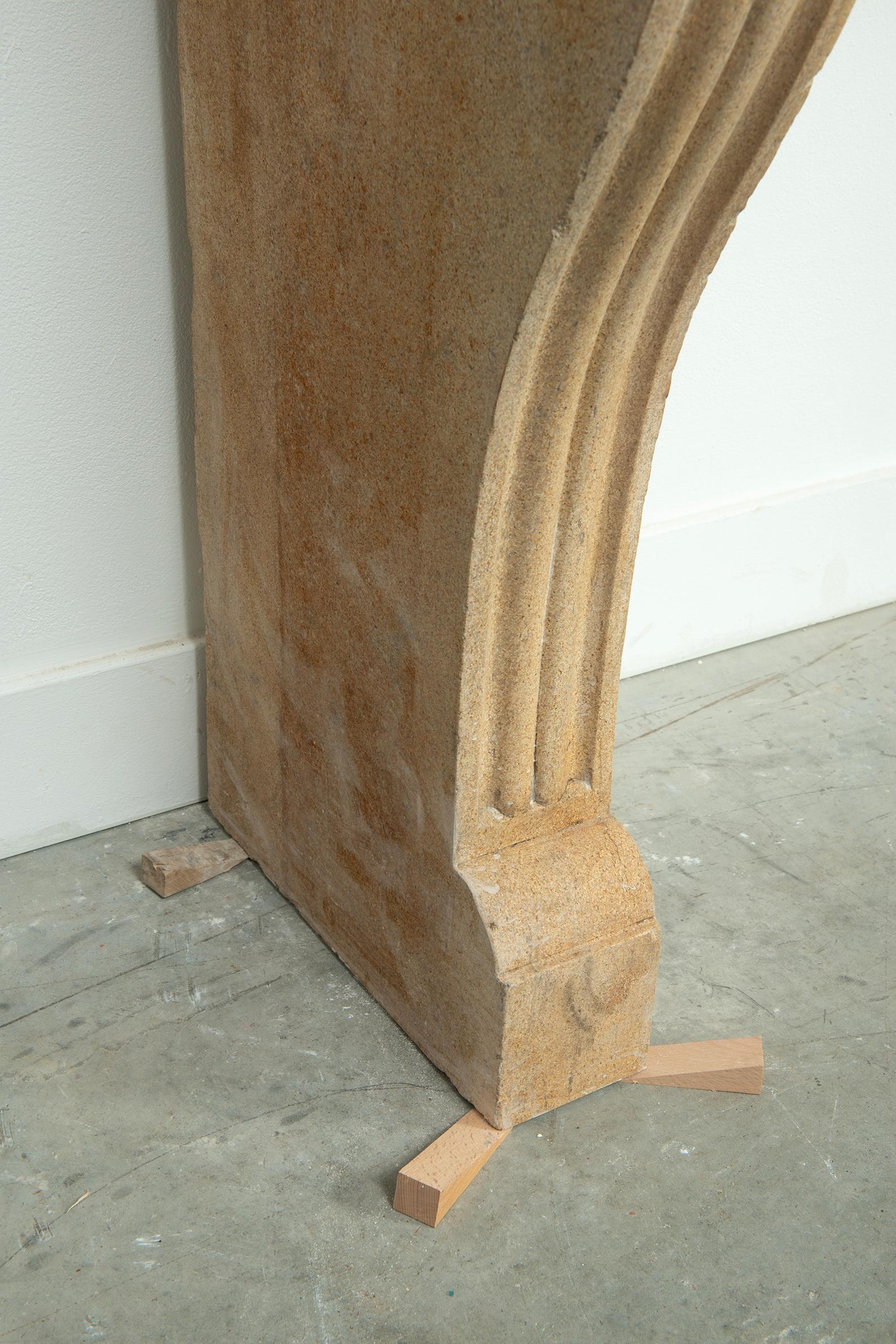 19th Century French Campagnard Limestone Fireplace with Sculpted Scroll Jambs For Sale 15