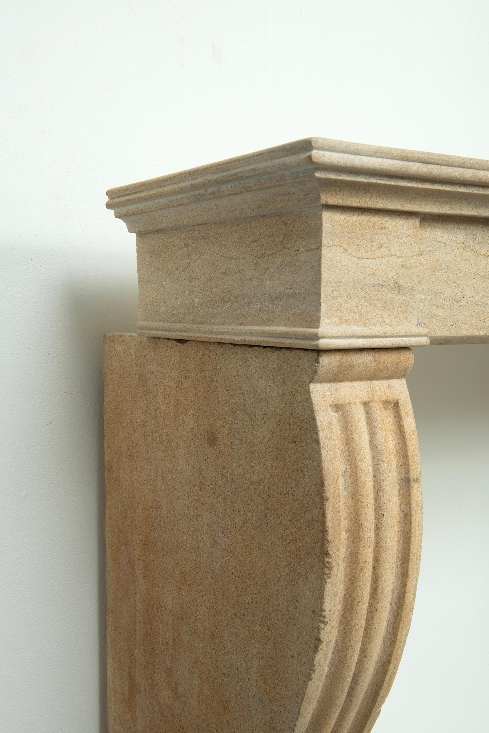19th Century French Campagnard Limestone Fireplace with Sculpted Scroll Jambs For Sale 16